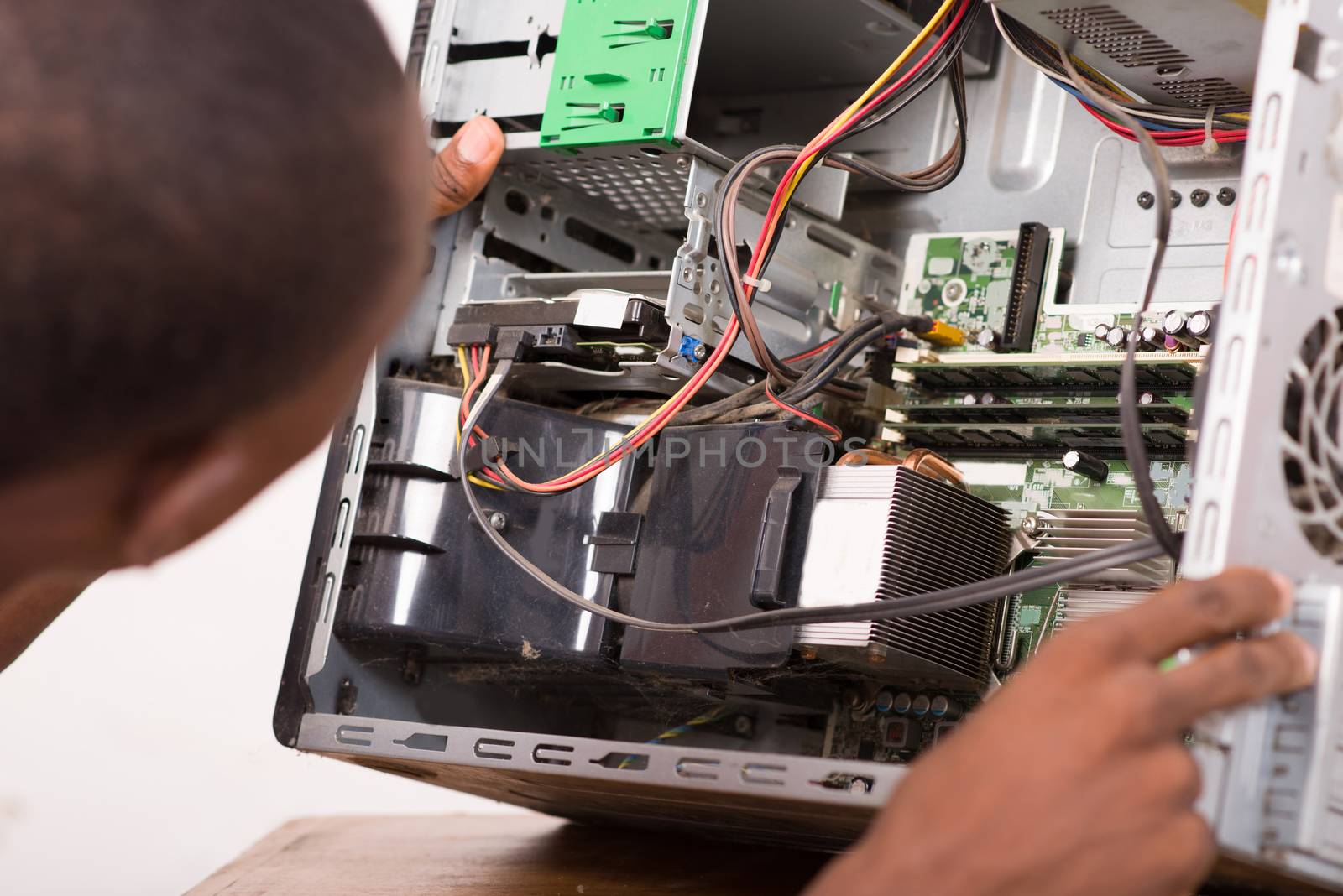 technician opens the computer hardware and verifies it.