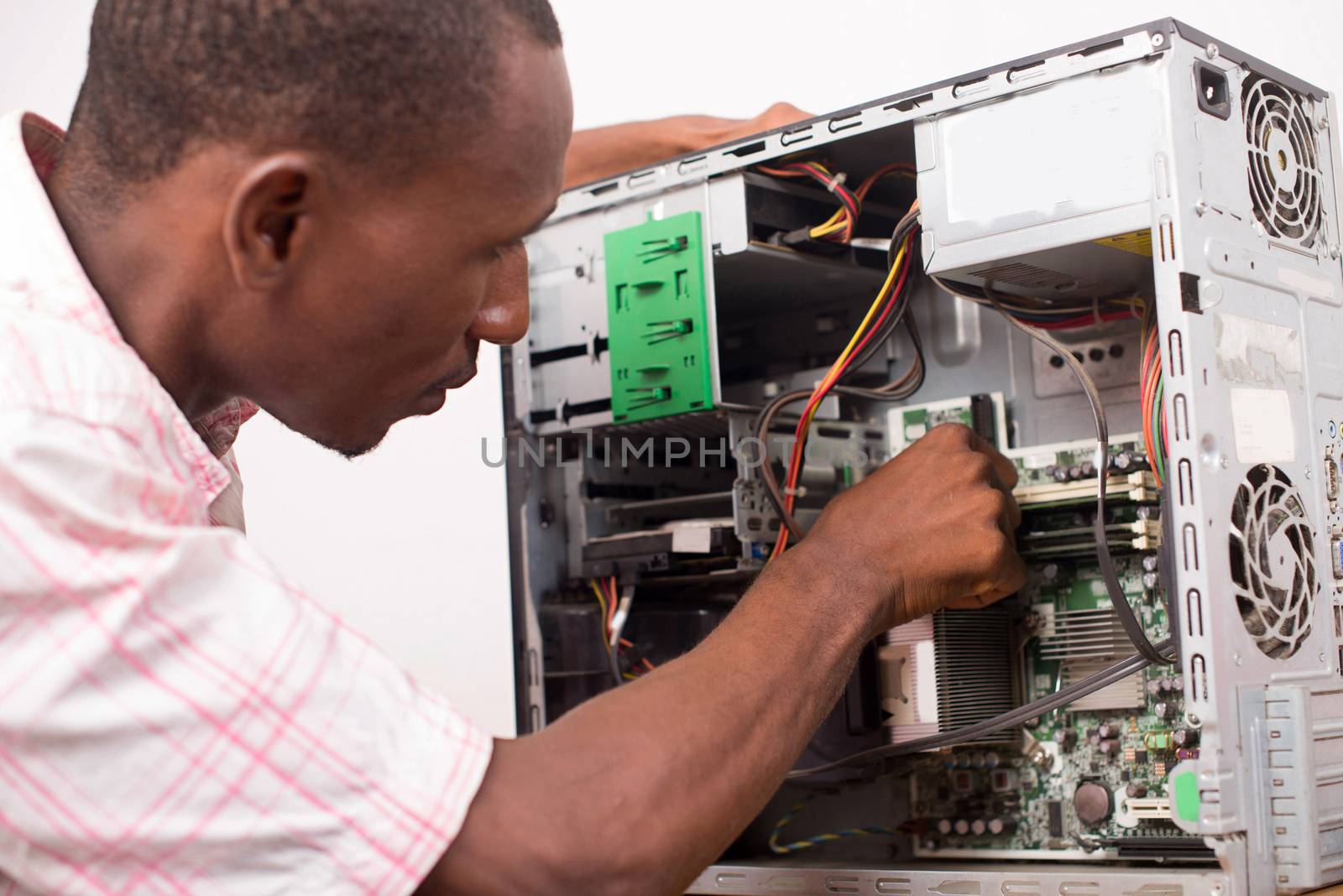 technician repairing computer equipment. by vystek