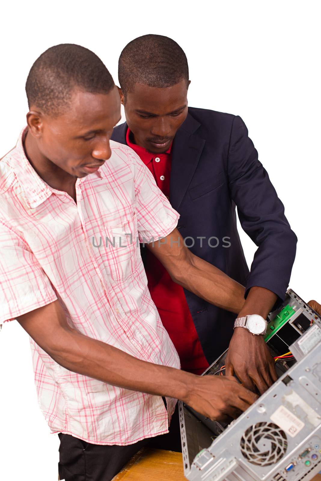 young computer expert repairing a computer by vystek