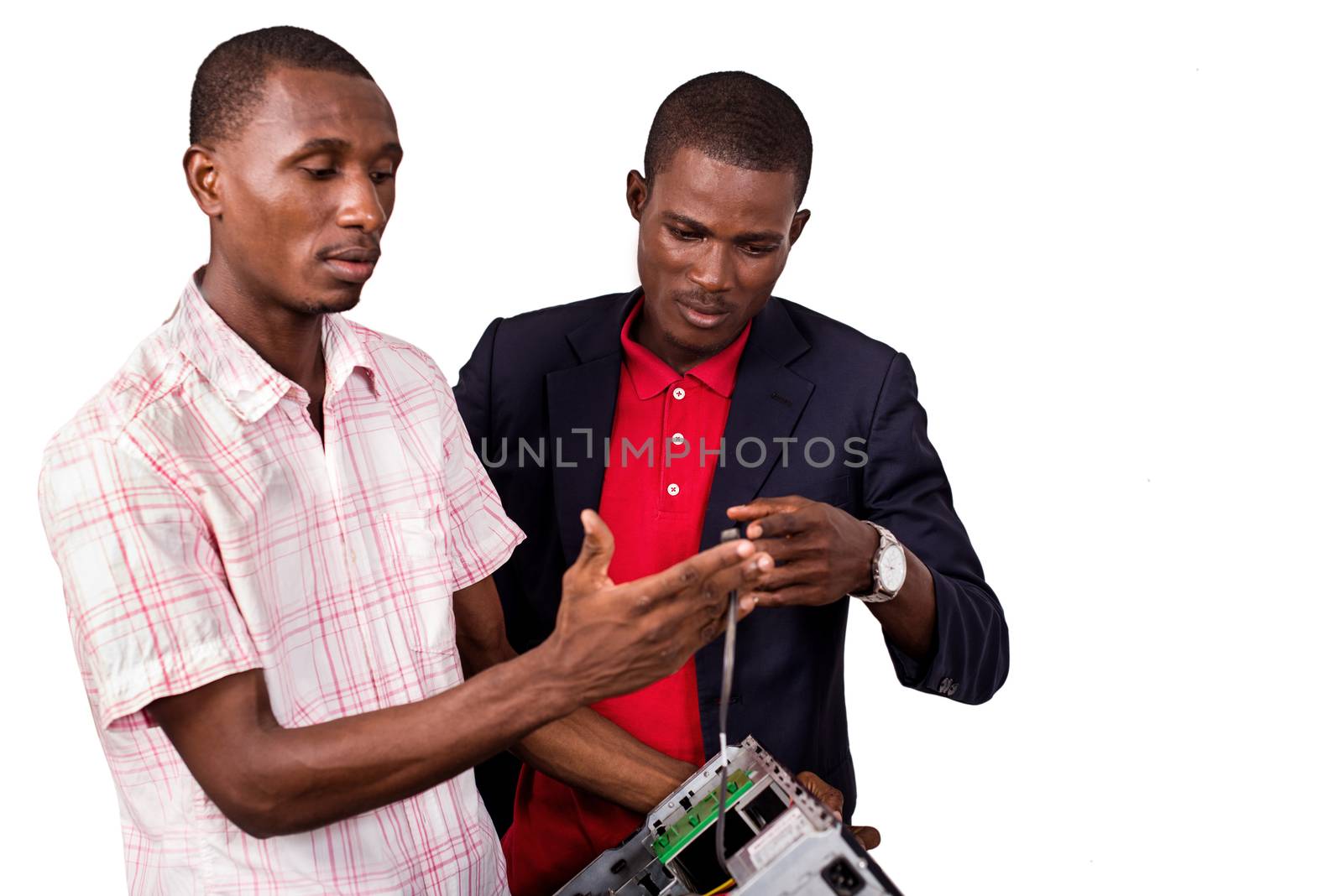 young computer expert repairing a computer by vystek