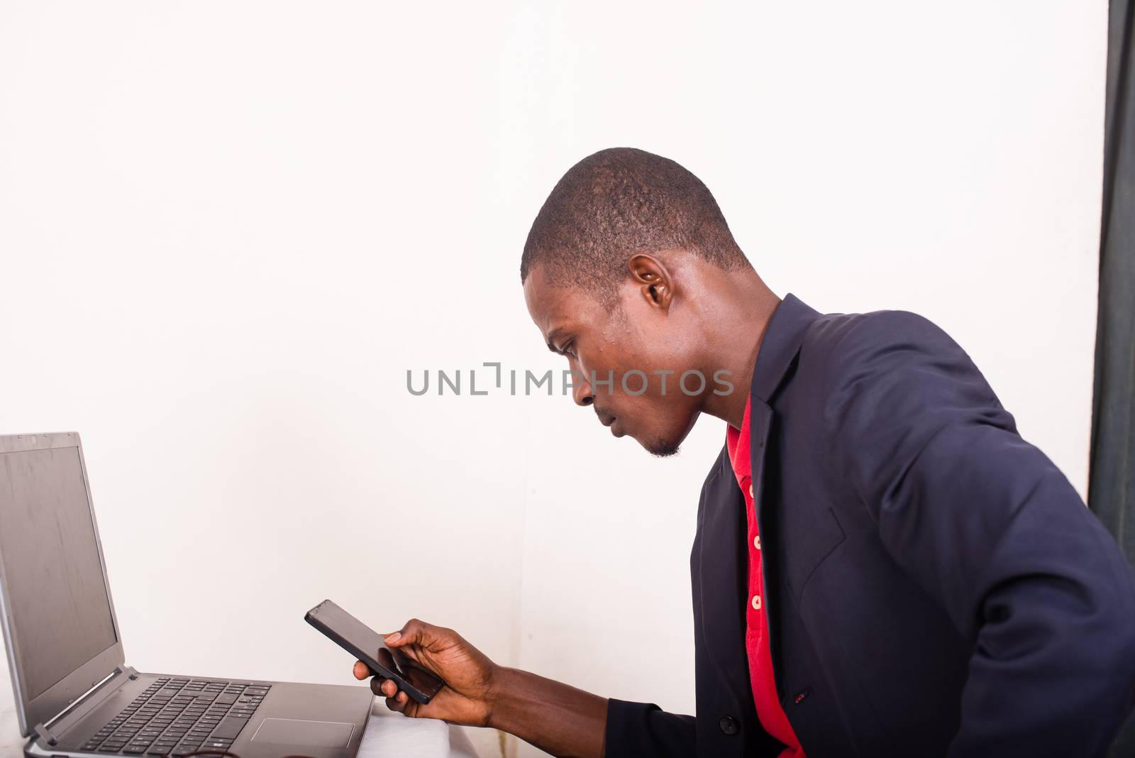 Businessman working in the office and using a mobile phone
