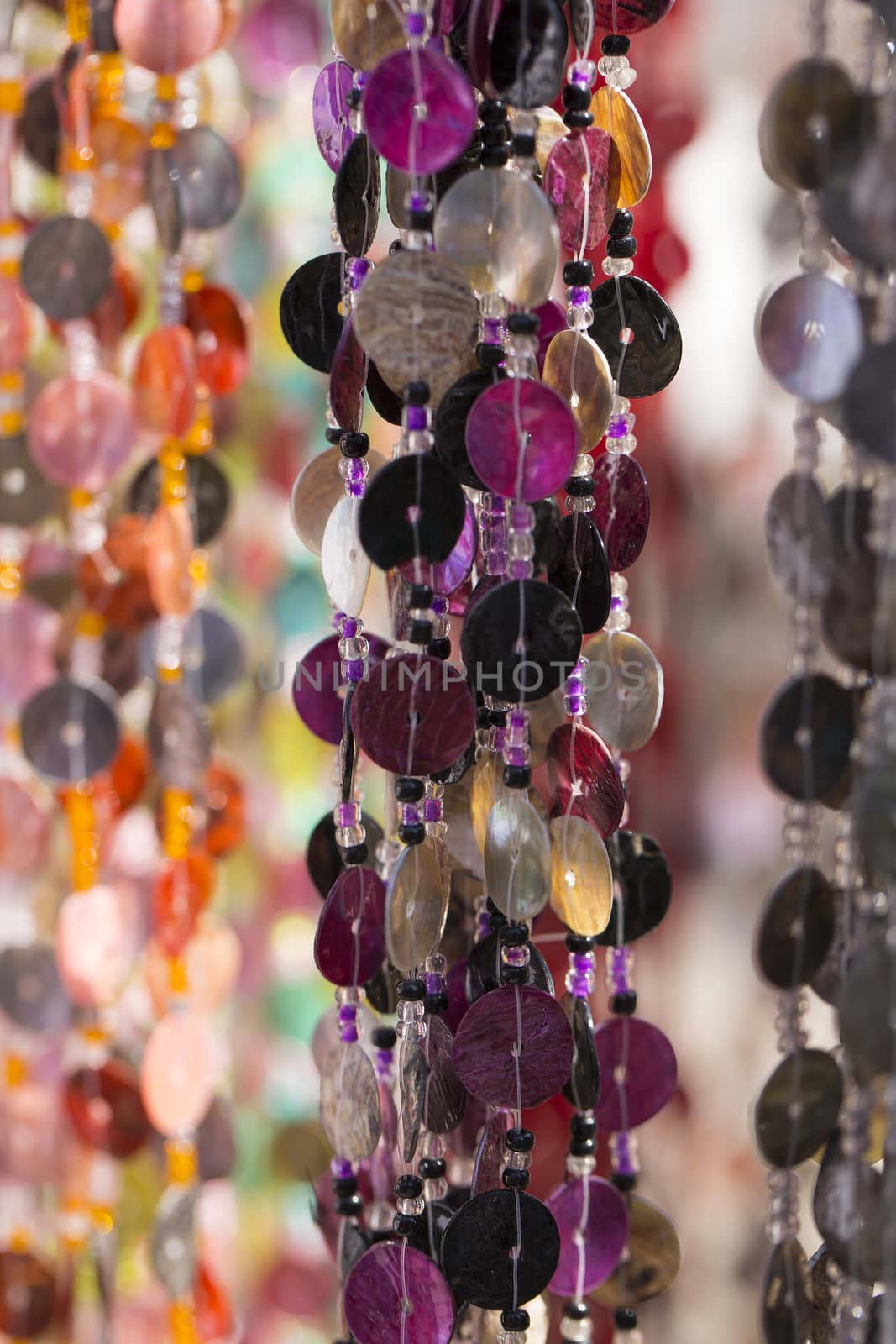 Colorful chains of plastic discs for room decoration