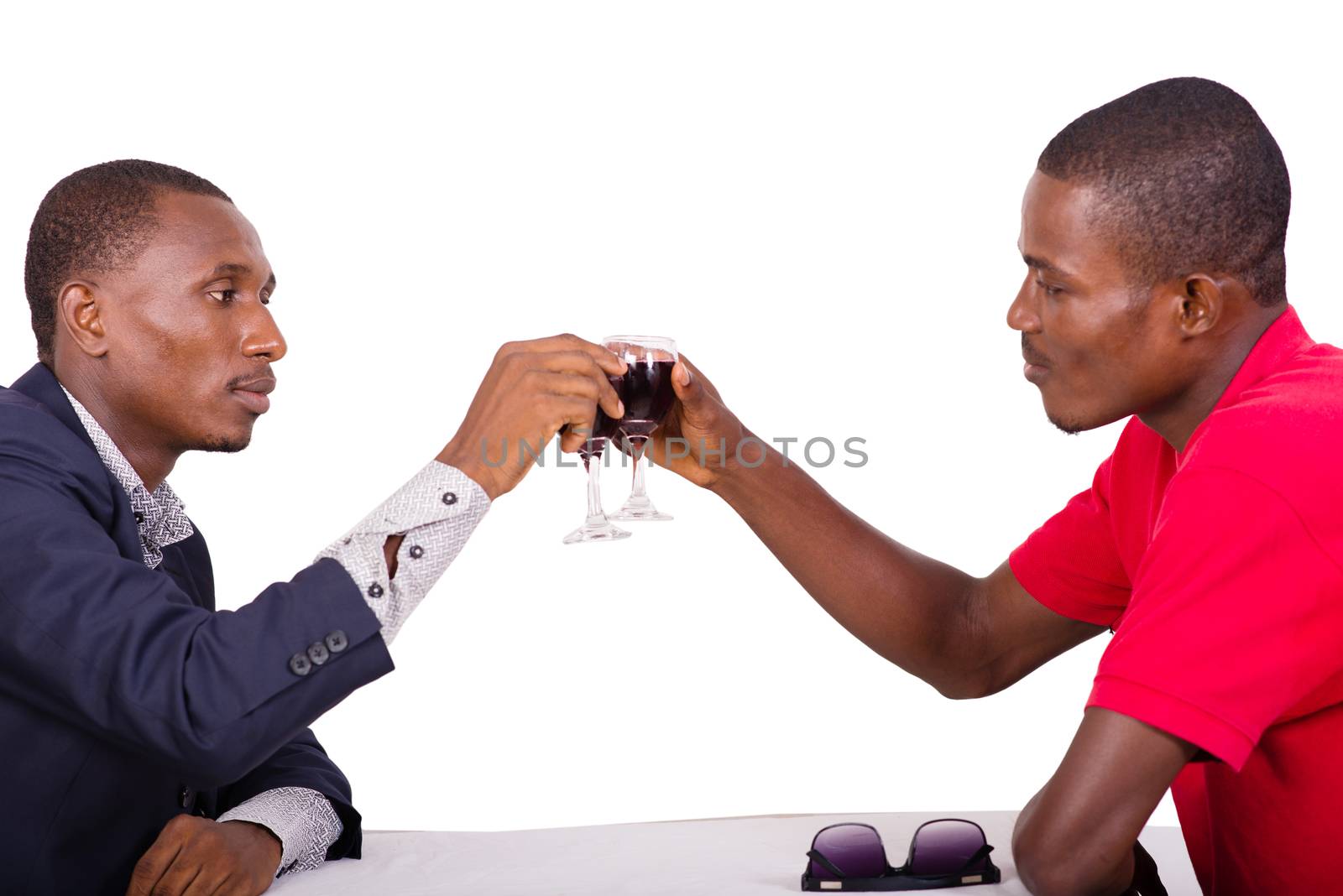 concept of smiling people going to make a toast with red wine at restaurant on white background