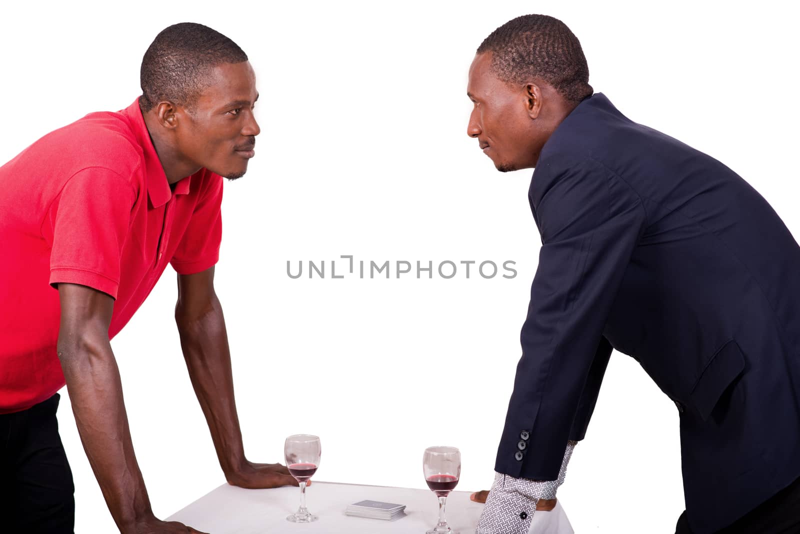 Two businessmen looking at each other with tension. Rivalry of business people.