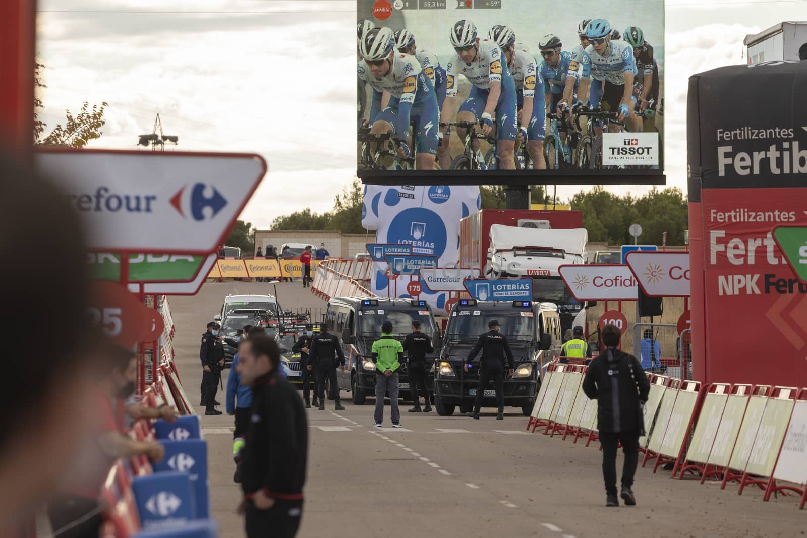 Staff and workers of the organization of the race and the cycling tour, in the finish area of the fourth stage of La Vuelta a España 2020.