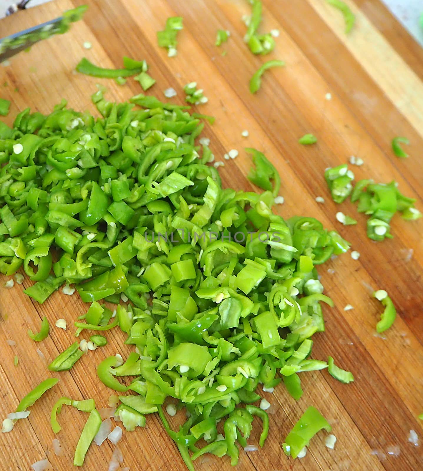 finely chopped green peppers on the cutting board