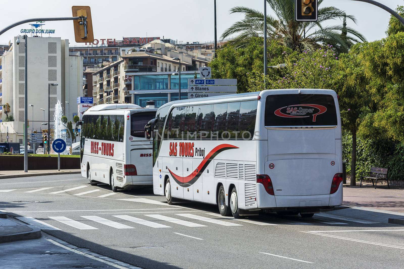 Spain, Lloret de Mar - 22 September 2017: Two bus tour companies BISS TOURS and TOURS SAS