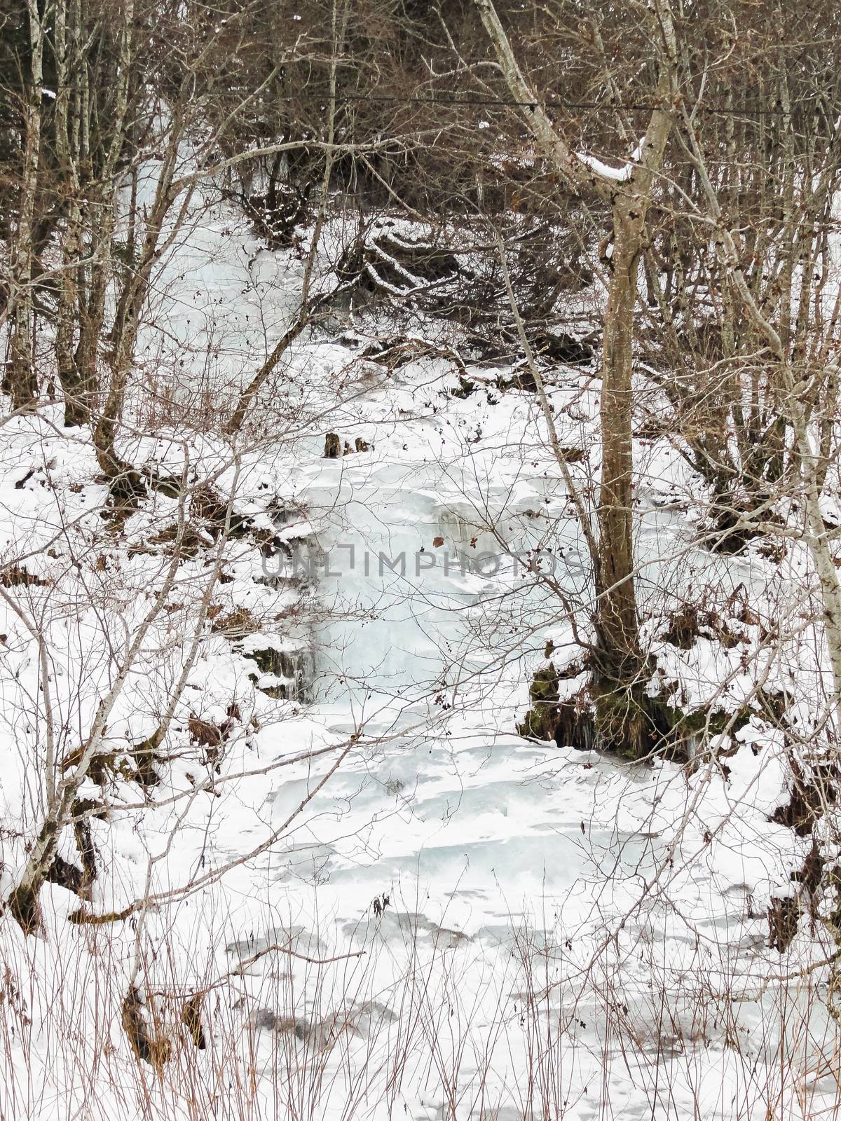 Frozen waterfall and icicles in a beautiful landscape in Norway.