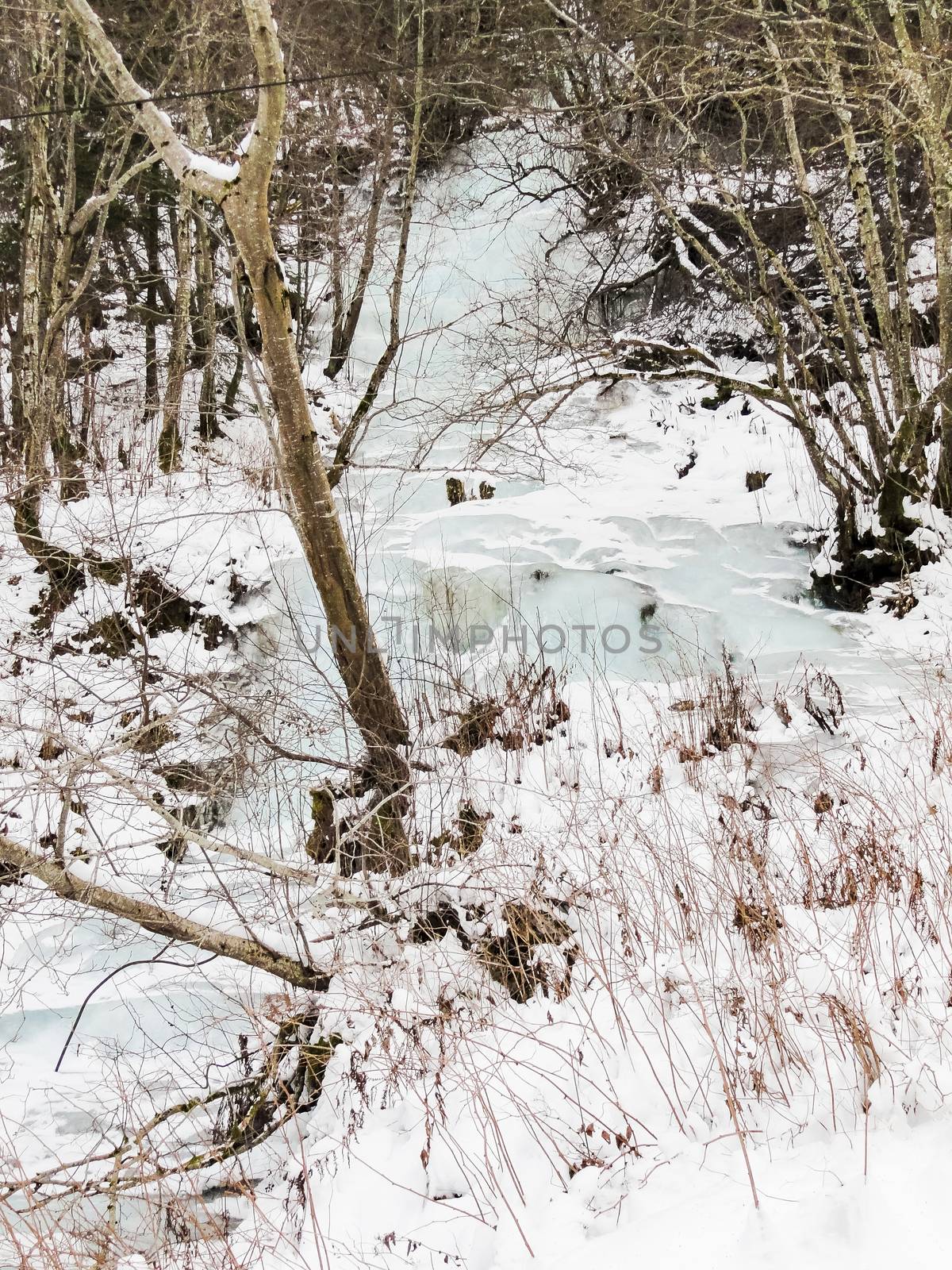 Frozen waterfall and icicles, beautiful landscape in Norway. by Arkadij