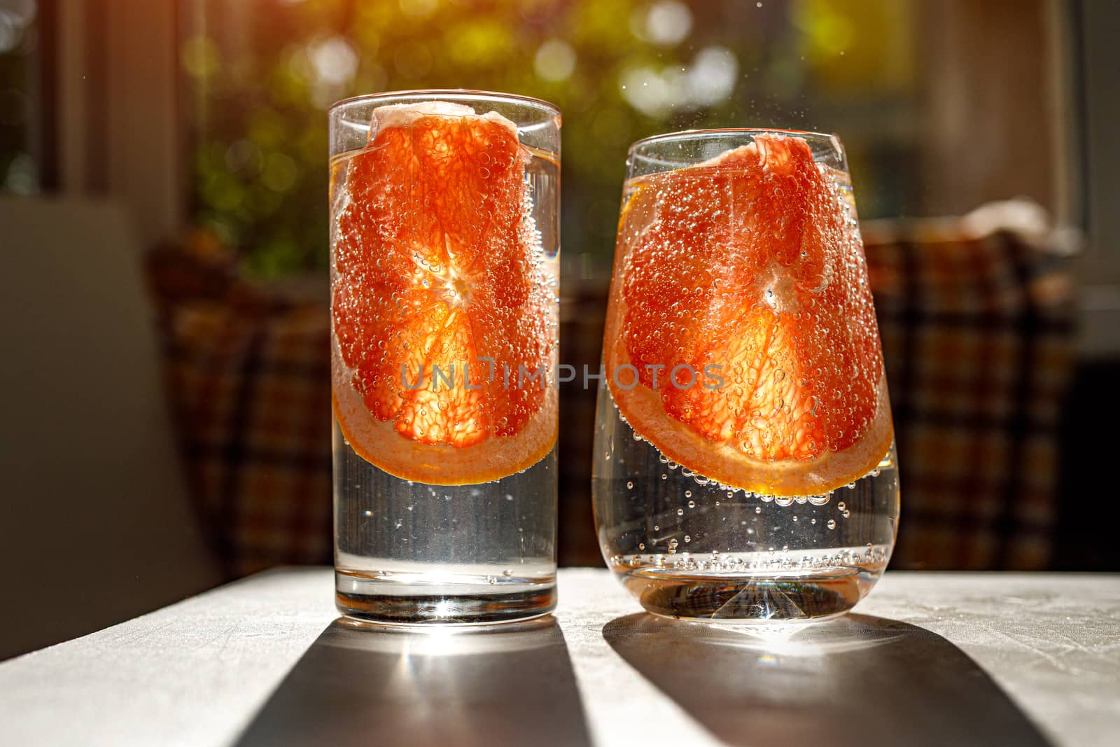 A glass of water with grapefruit. by 9parusnikov