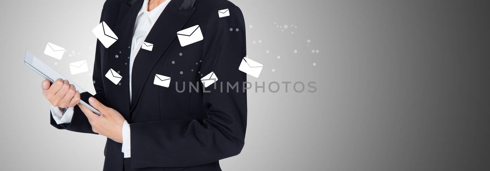 Hand holding woman check and sending message with email in a phone on grey background, banner communication concept.