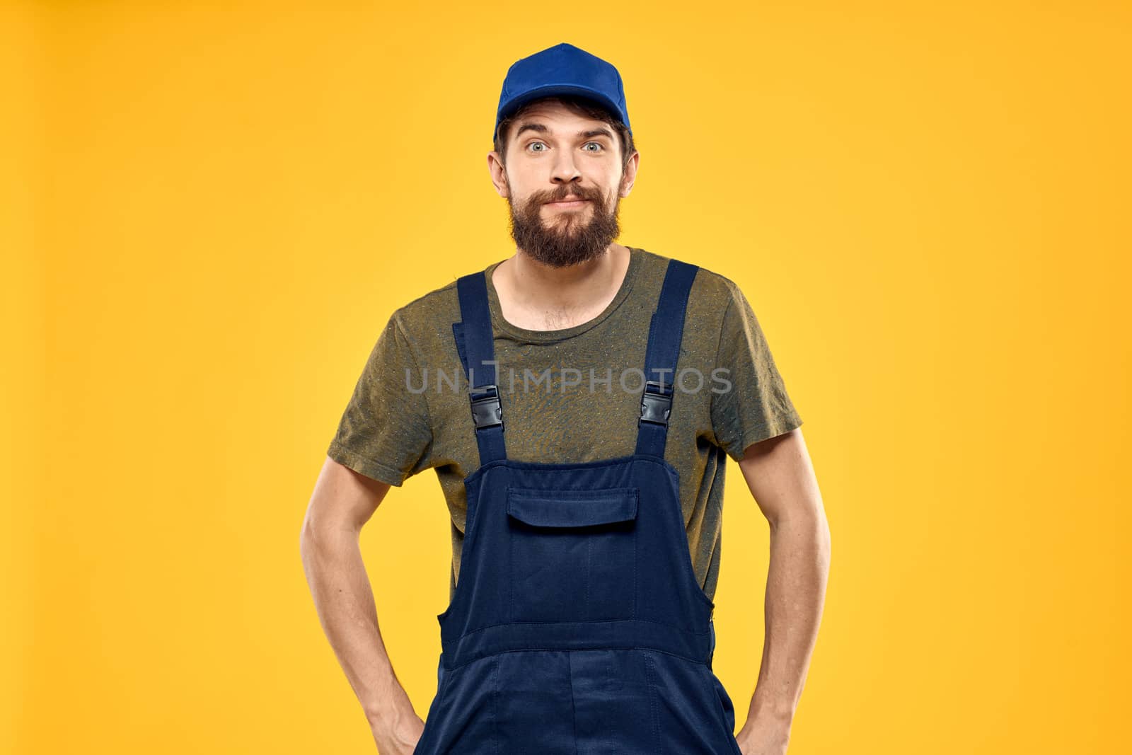 man in work uniform rendering service forklift work lifestyle yellow background by SHOTPRIME