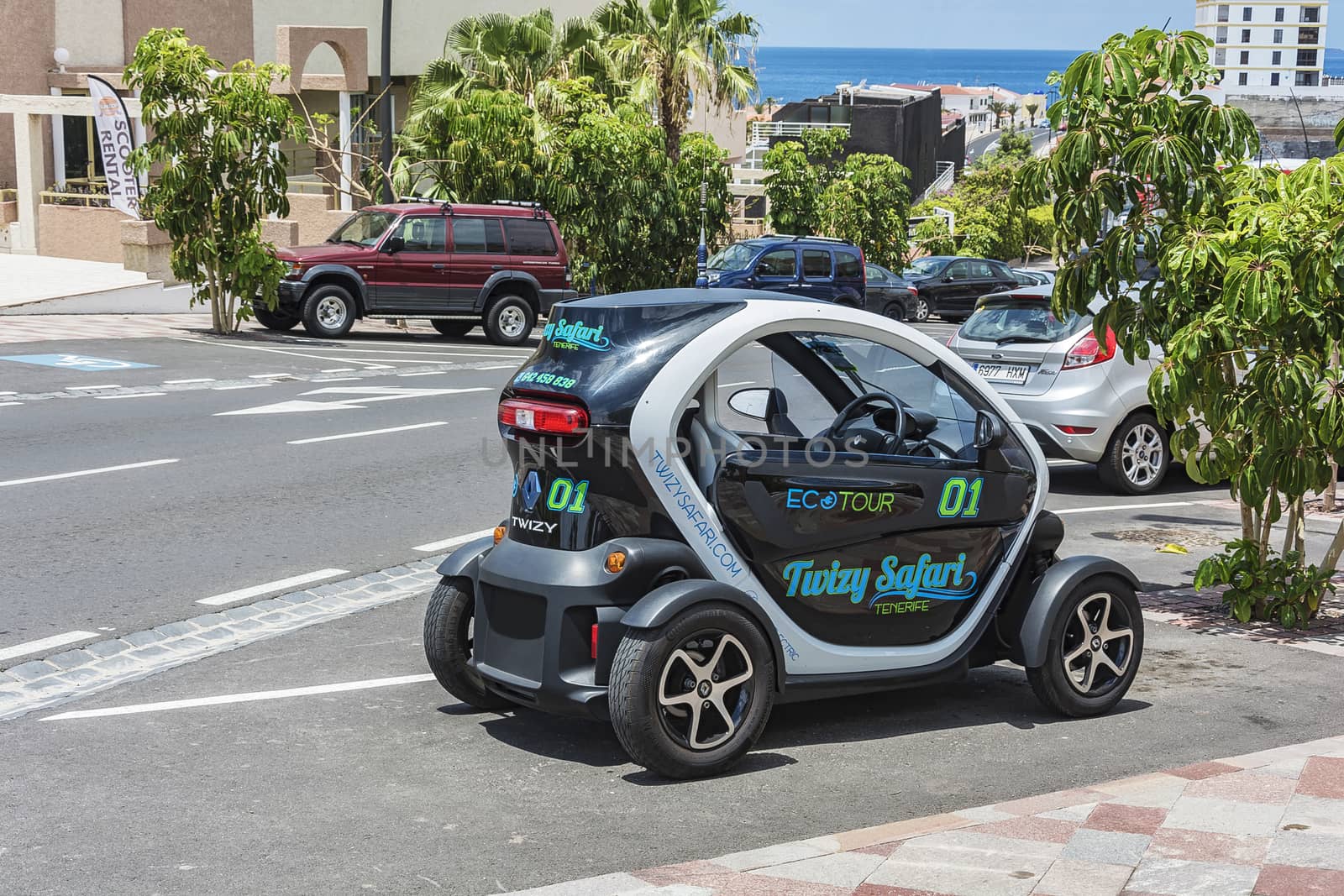 Renault Twizy car is parked in a city street (Tenerife, Spain) by Grommik