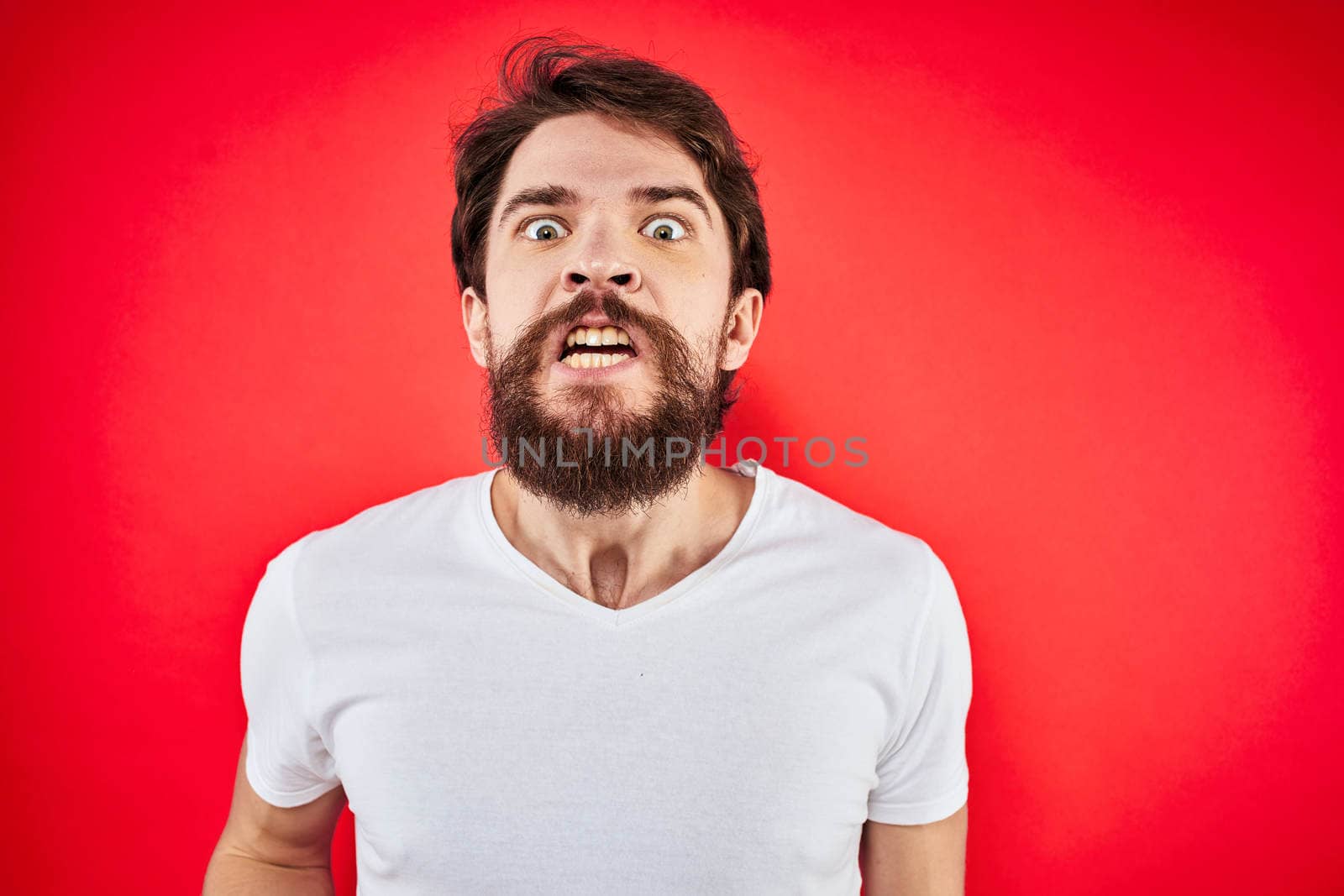 man in t-shirt gesturing with his hands dissatisfaction studio red uniform by SHOTPRIME