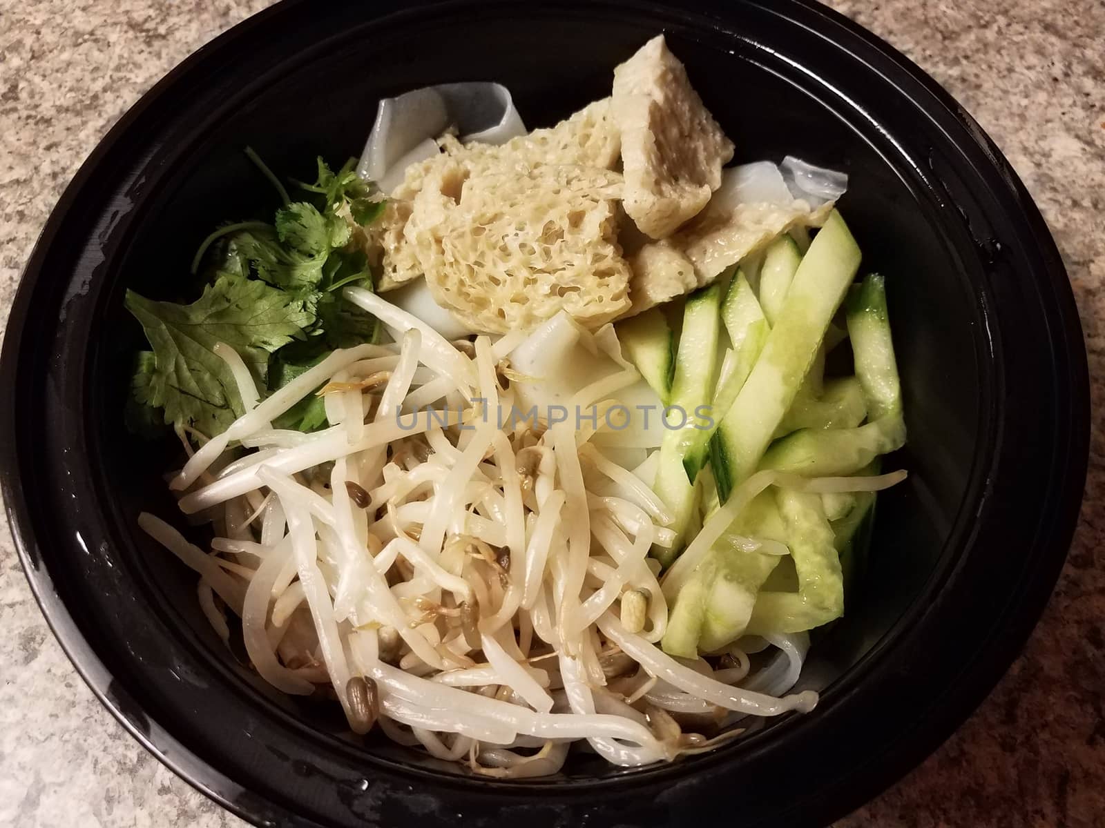 bowl of asian tofu and noodles and vegetables