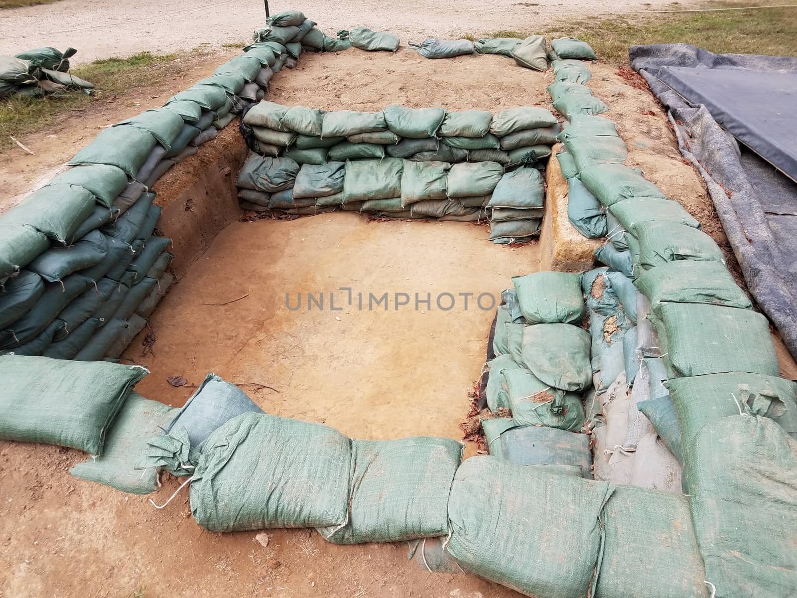 sandbags in archeology dug pit or hole by stockphotofan1