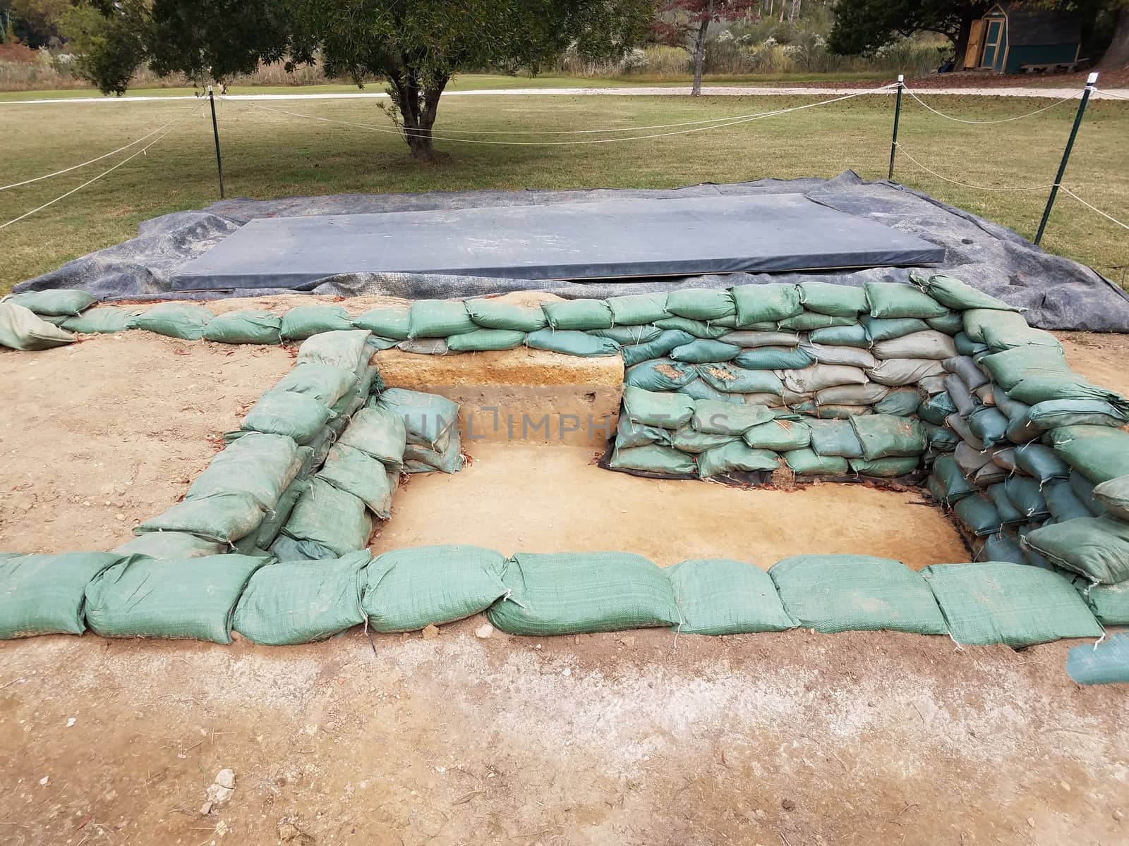 heavy sandbags in archeology dug pit or hole