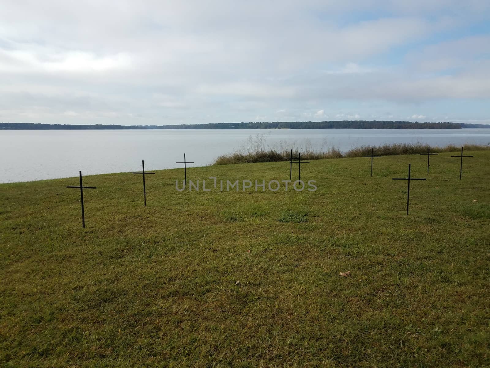 crosses on green grass or lawn near river water