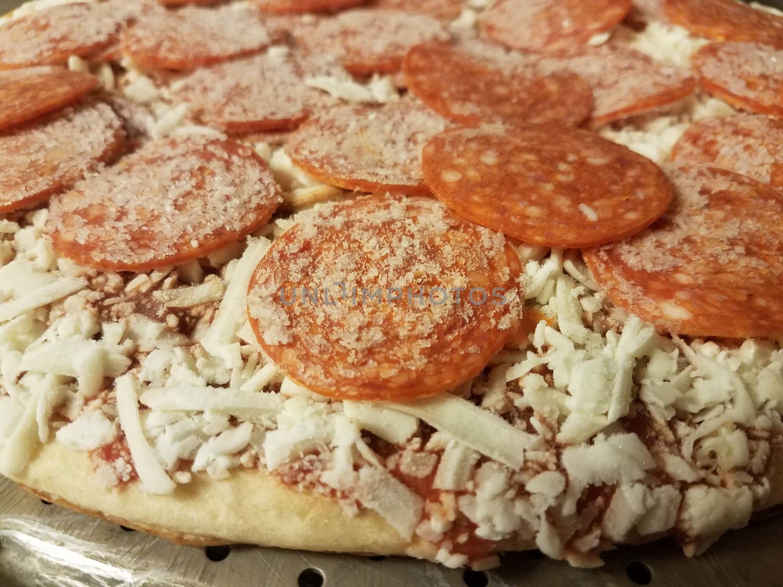 frozen cold pepperoni meat pizza with cheese by stockphotofan1