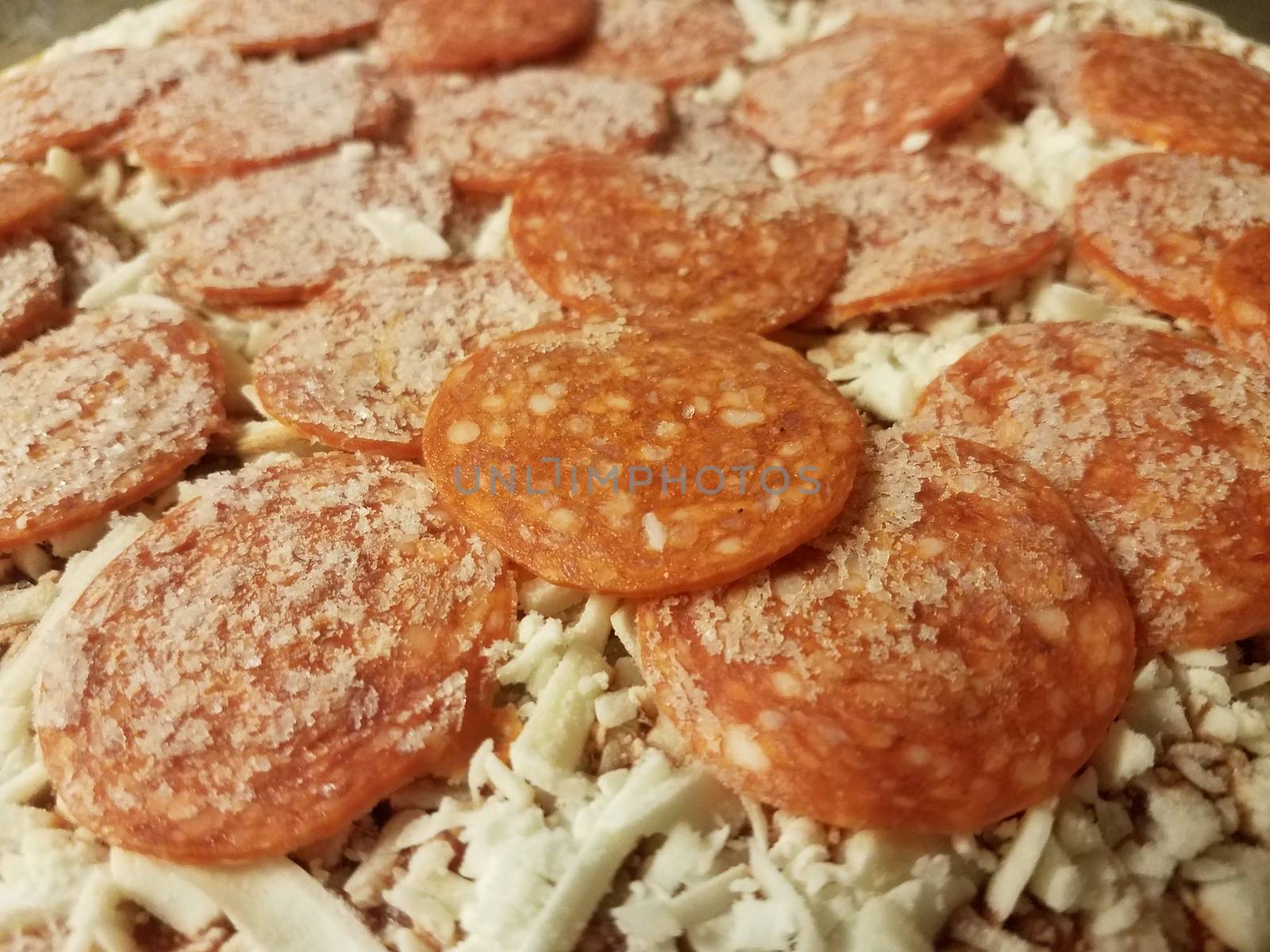 frozen cold pepperoni meat pizza with cheese by stockphotofan1