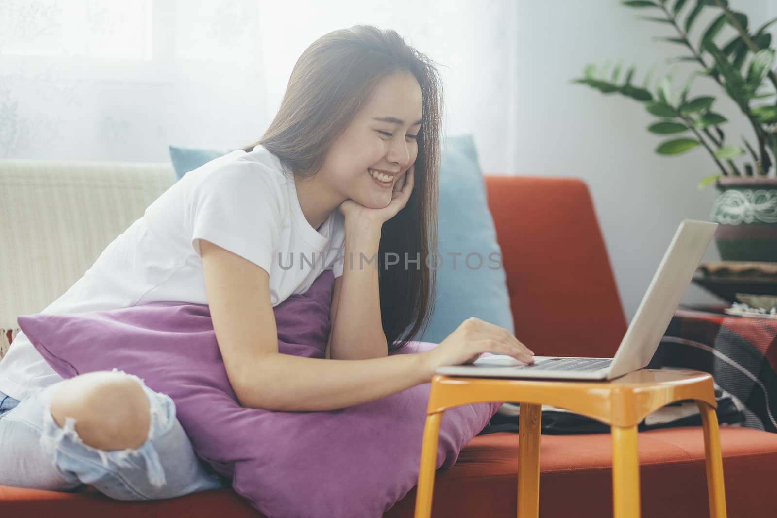 Attractive young Asia woman working at home. Working and learning from home.

