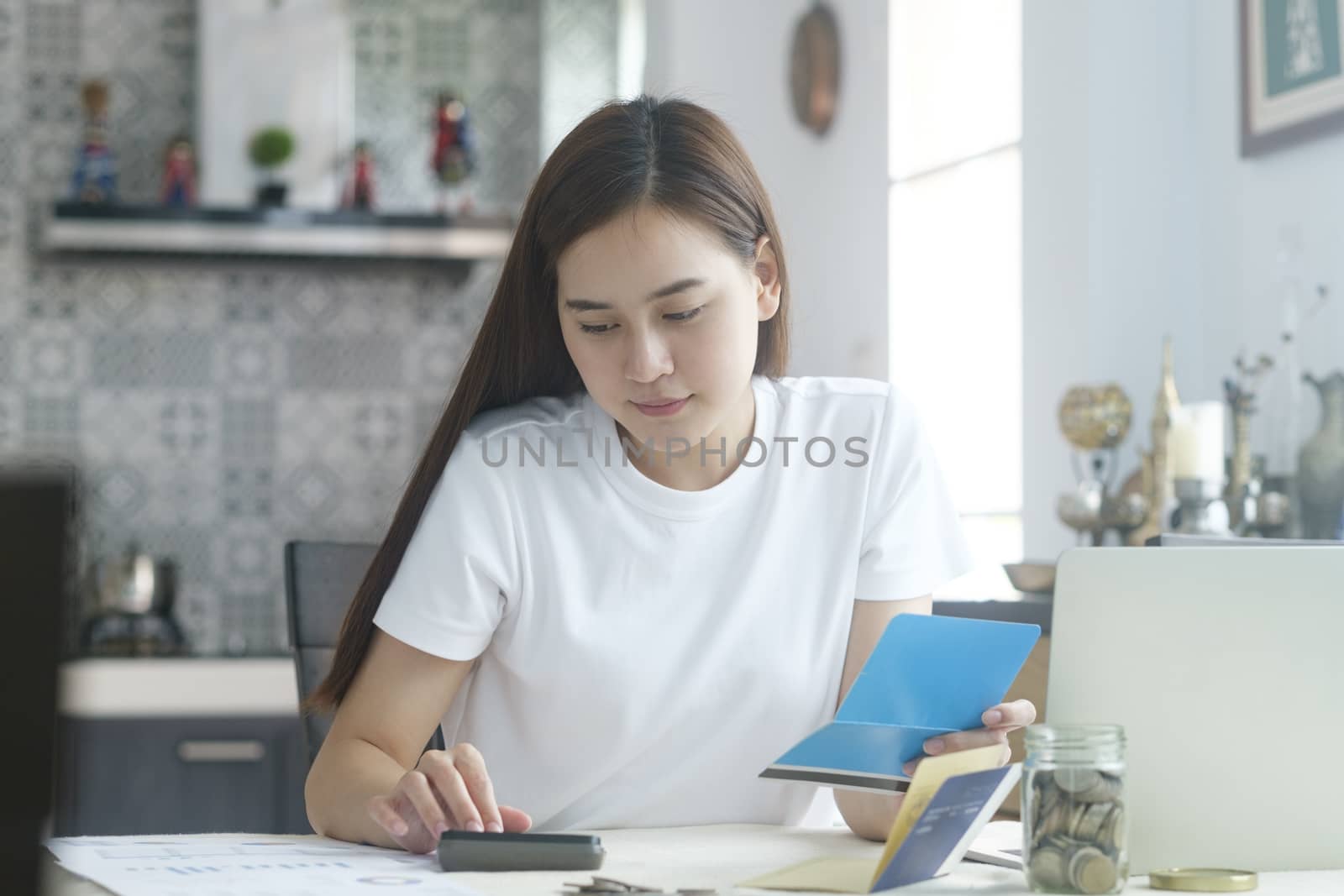 Attractive young Asia woman working at home. Working and learning from home.

