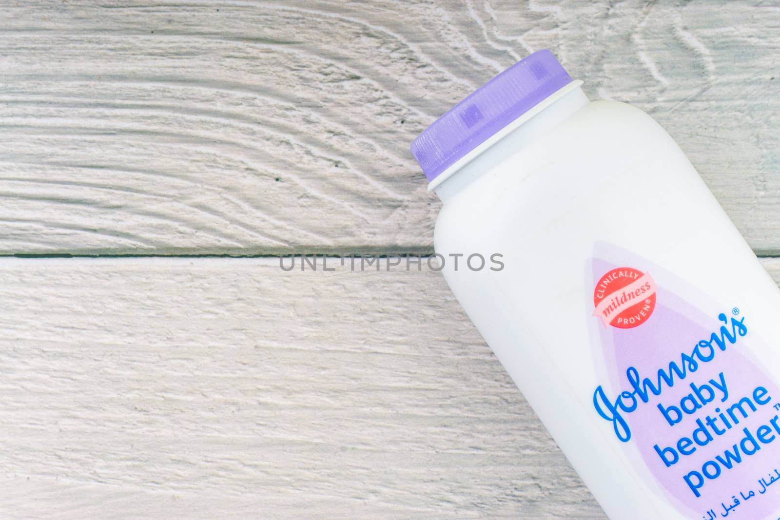 Kuala Lumpur, Malaysia - October 19, 2020 : Johnson and Johnson Baby bedtime powder talcum on wooden background by silverwings