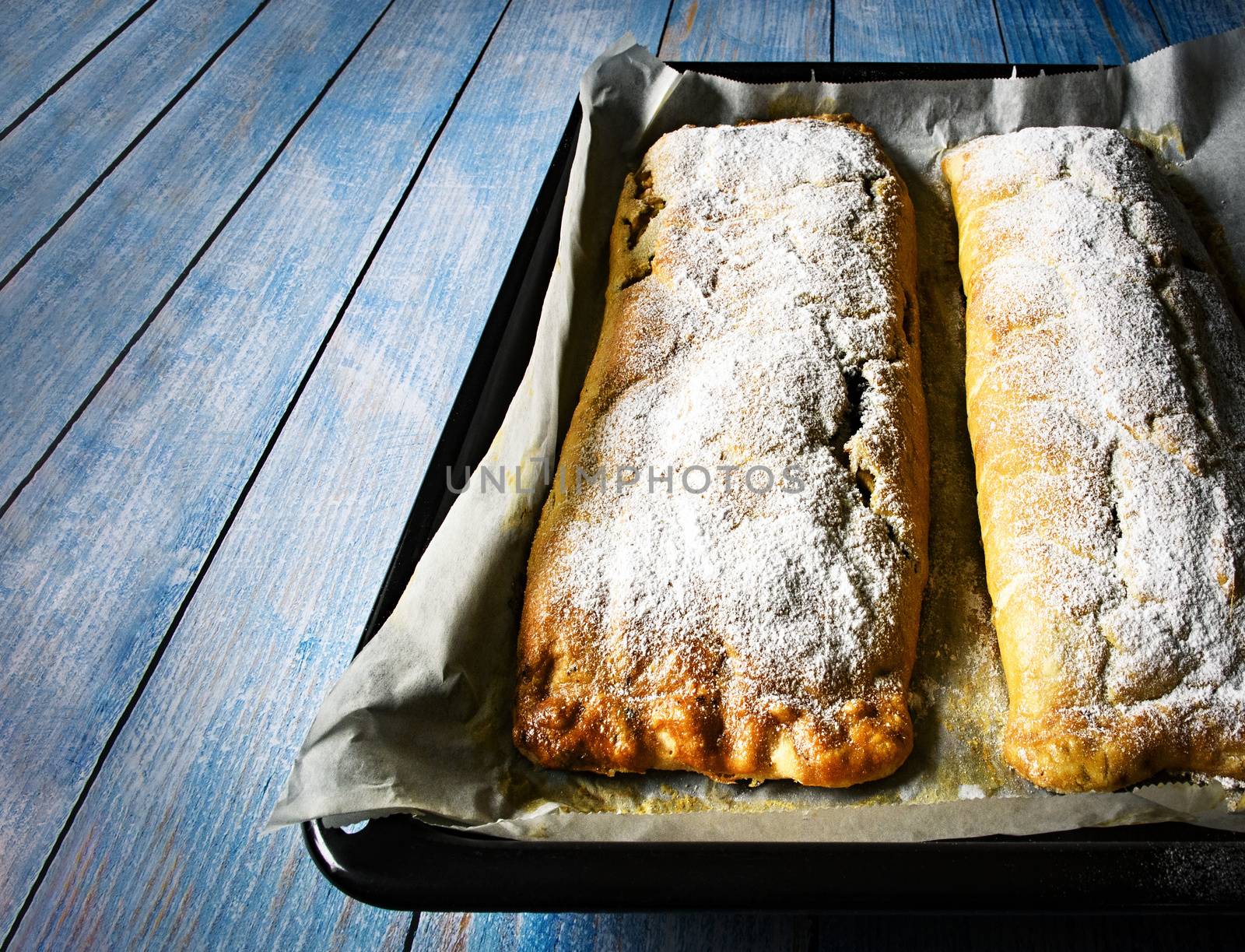 freshly baked strudel on a baking sheet by Ahojdoma