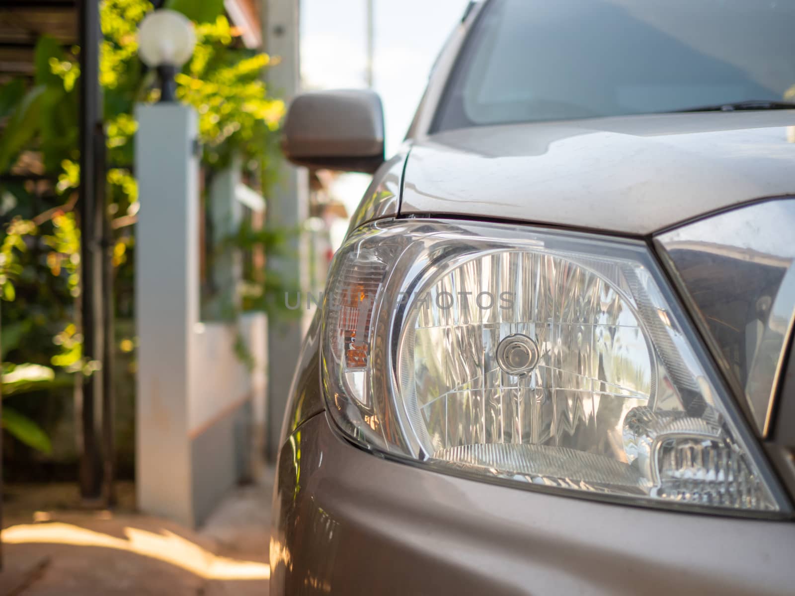 A picture of a golden bronze car headlight. With copy space