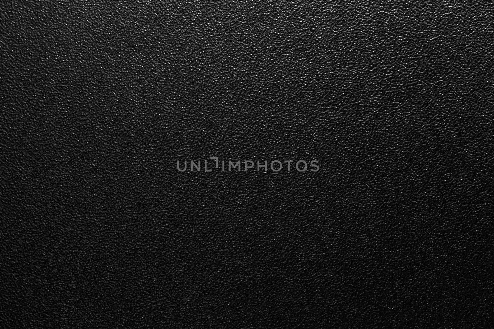 Dark full frame background of hammered powder paint coating on flat sheet steel surface. Also known as hammertone effect.