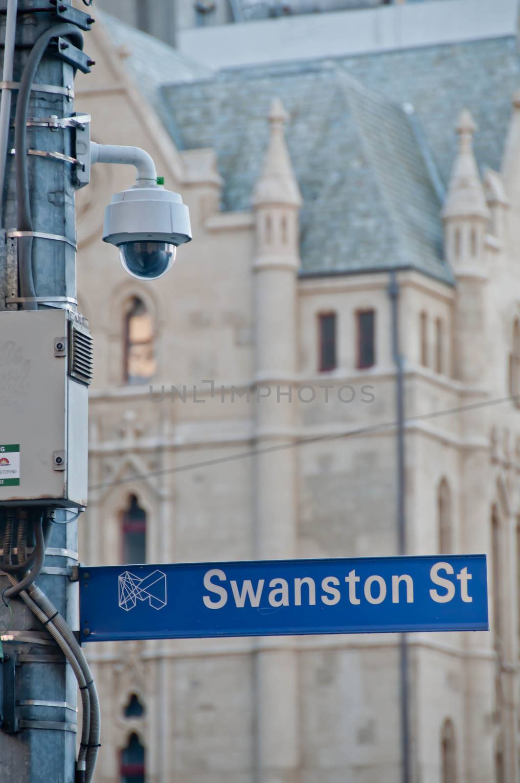 MELBOURNE, AUSTRALIA - JULY 29, 2018: Surveillance CCTV street outdoor camera watching pedestrian near St Paul's cathedral church in city center to prevent terrorism. The photo is taken in the afternoon.