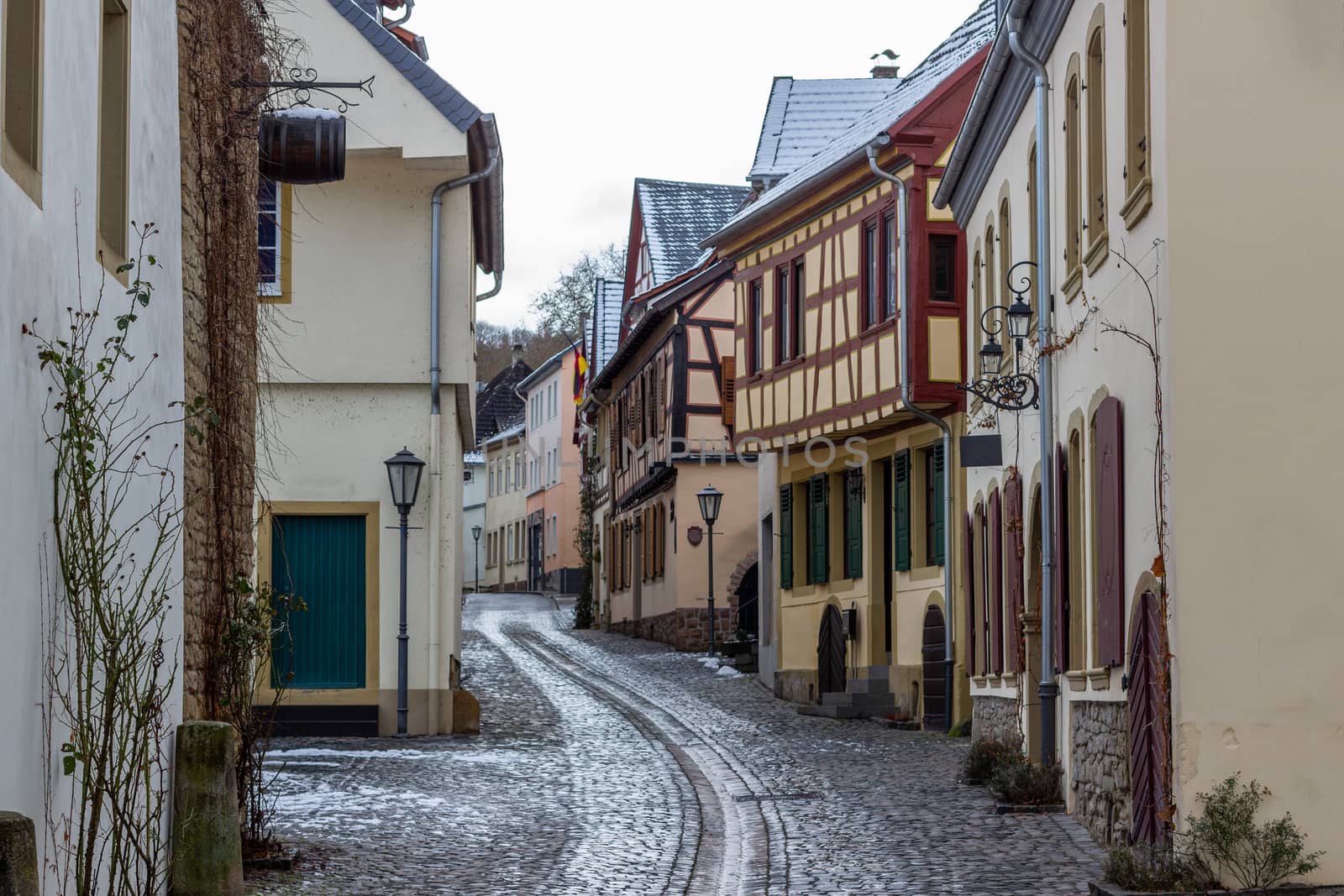 Cobbled alley with half-timbered houses in the city Meisenheim, Germany in winter