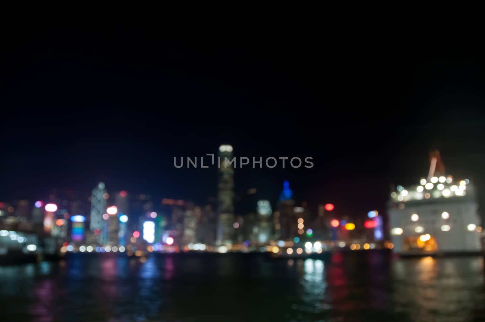 Light blur motion scene defocused modern building lights at night with ocean bay by eyeofpaul