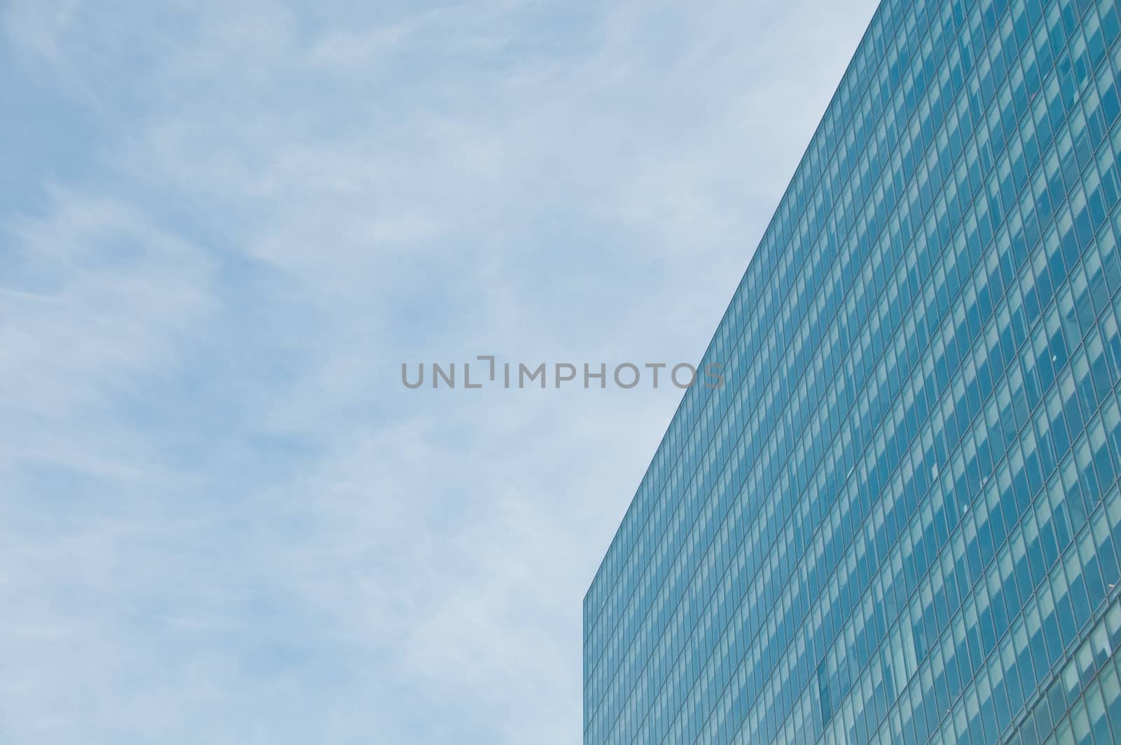 Blue sky and futuristic modern corporate office building