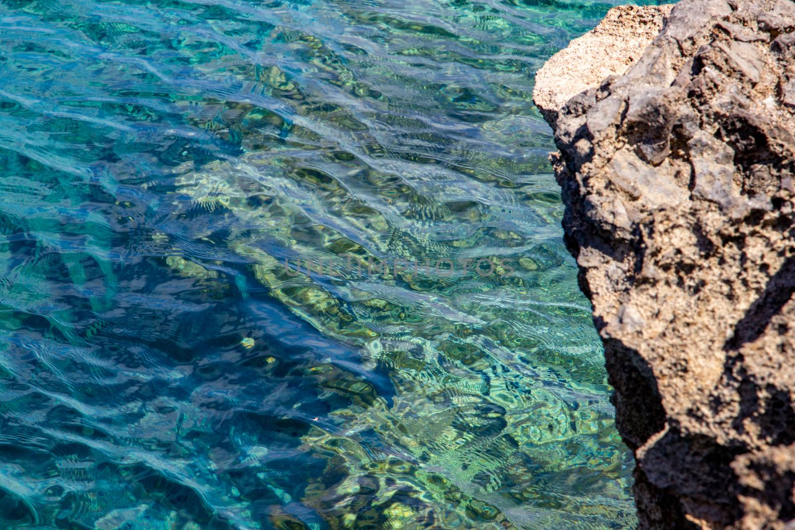 Bay on the peninsula La Victoria, Mallorca with clear blue water and rock