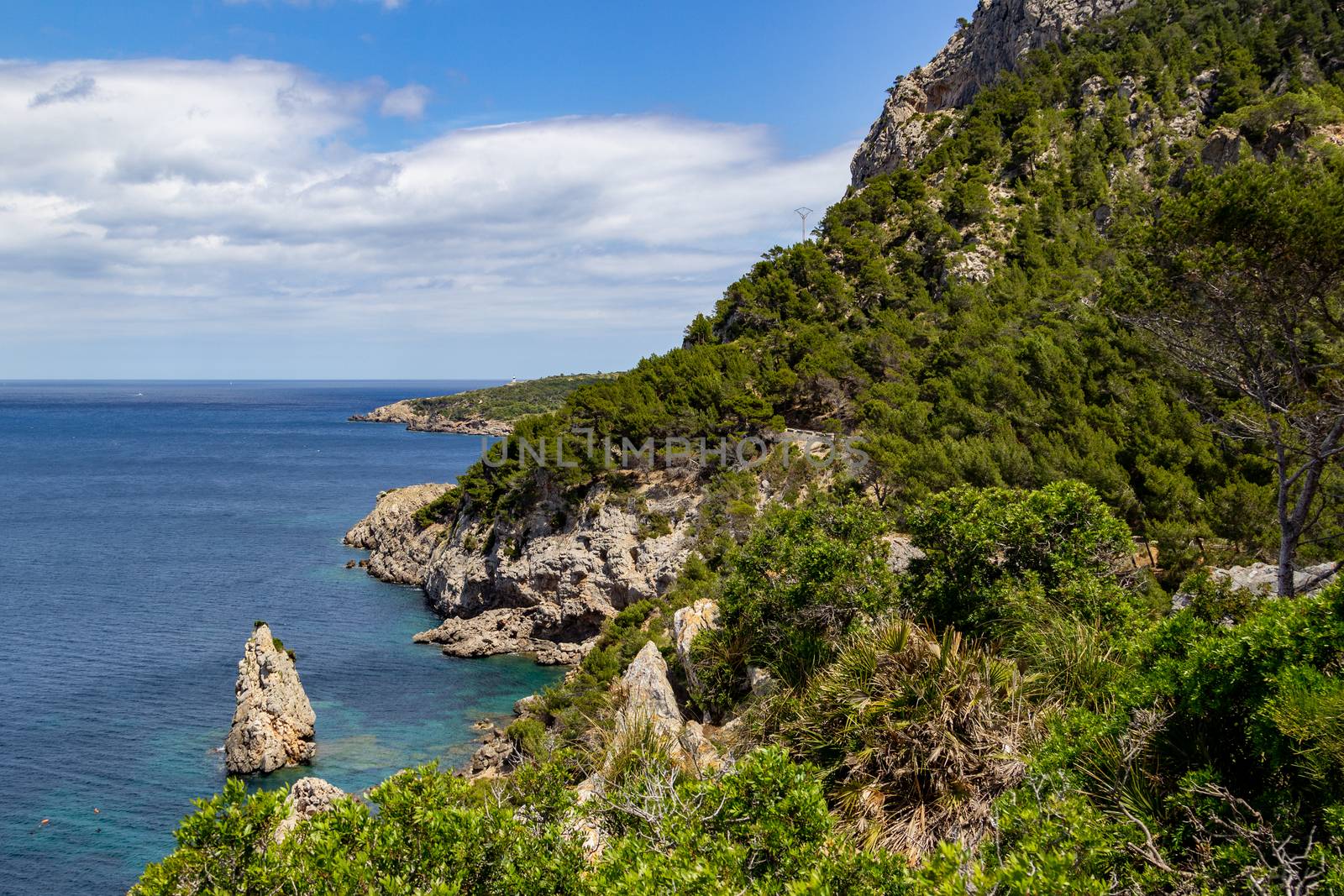 Bay Ses Caletes on the peninsula La Victoria, Mallorca with rocky coastline and turquoise clear water