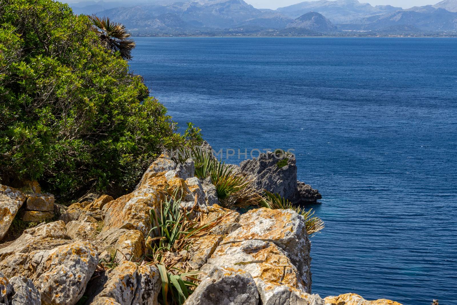 Bay on the peninsula La Victoria, Mallorca with rock in the water and rocky coastline