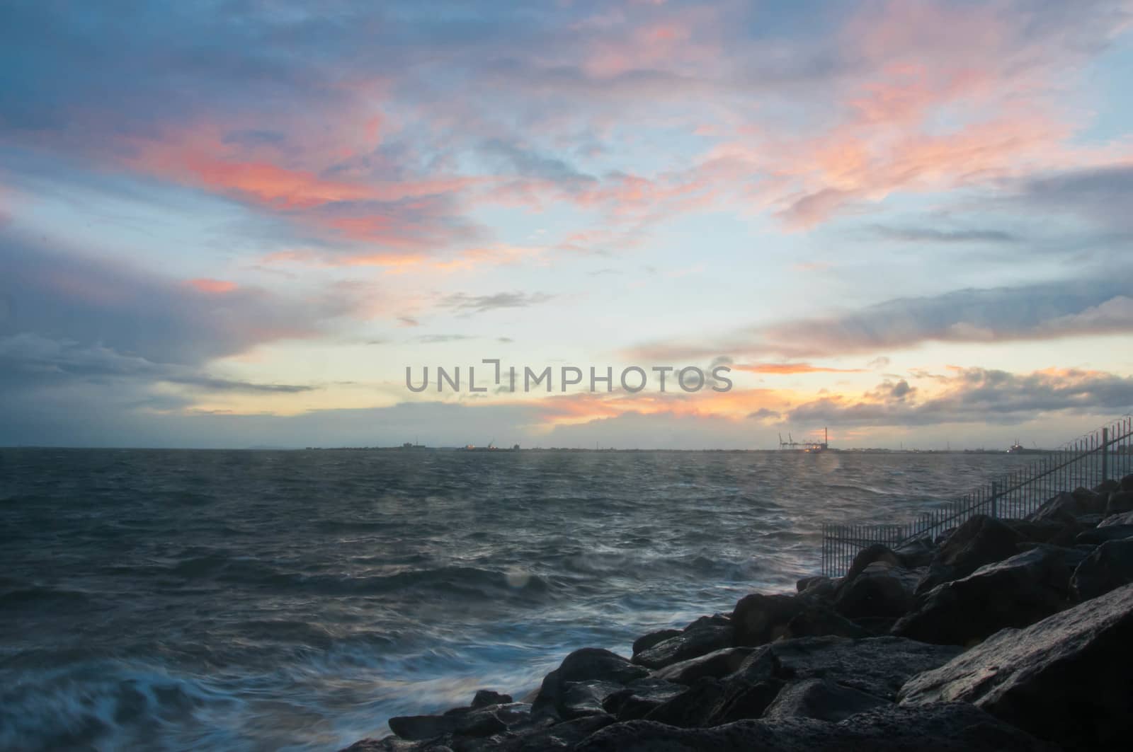 Dramatic splashing ocean wave in the evening with twilight sky i by eyeofpaul