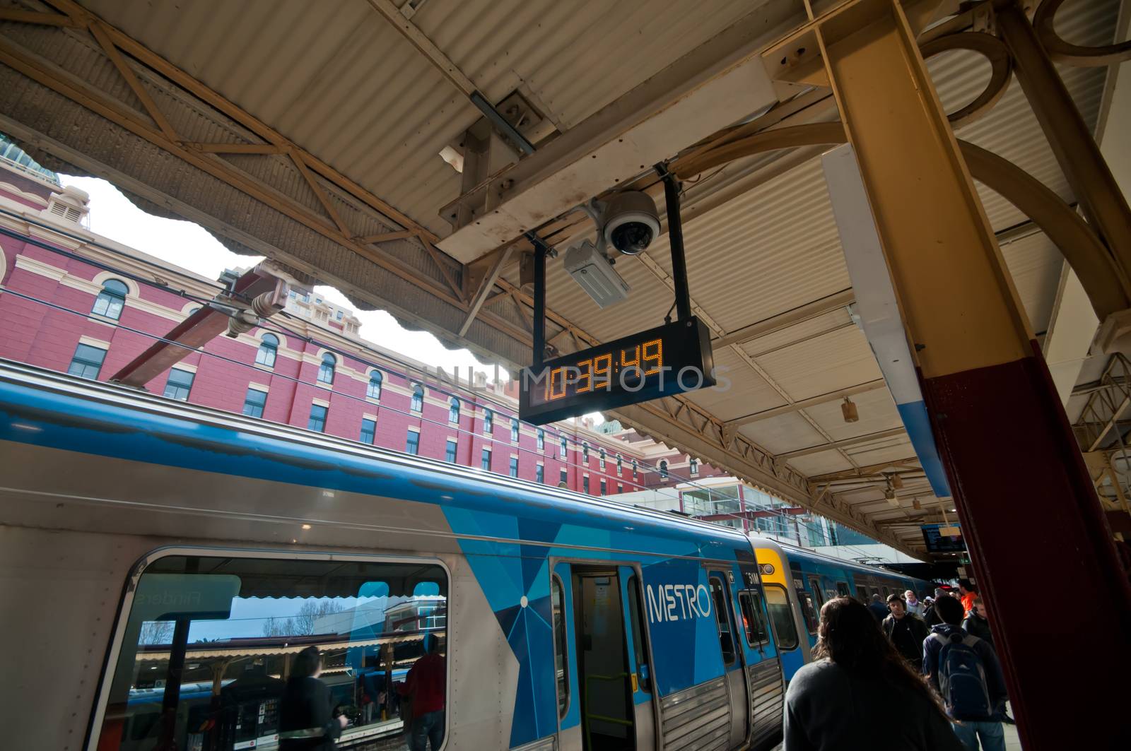 MELBOURNE, AUSTRALIA - JULY 26, 2018: Local blue Metro city train parks at Flinders street station in Melbourne Victoria Australia