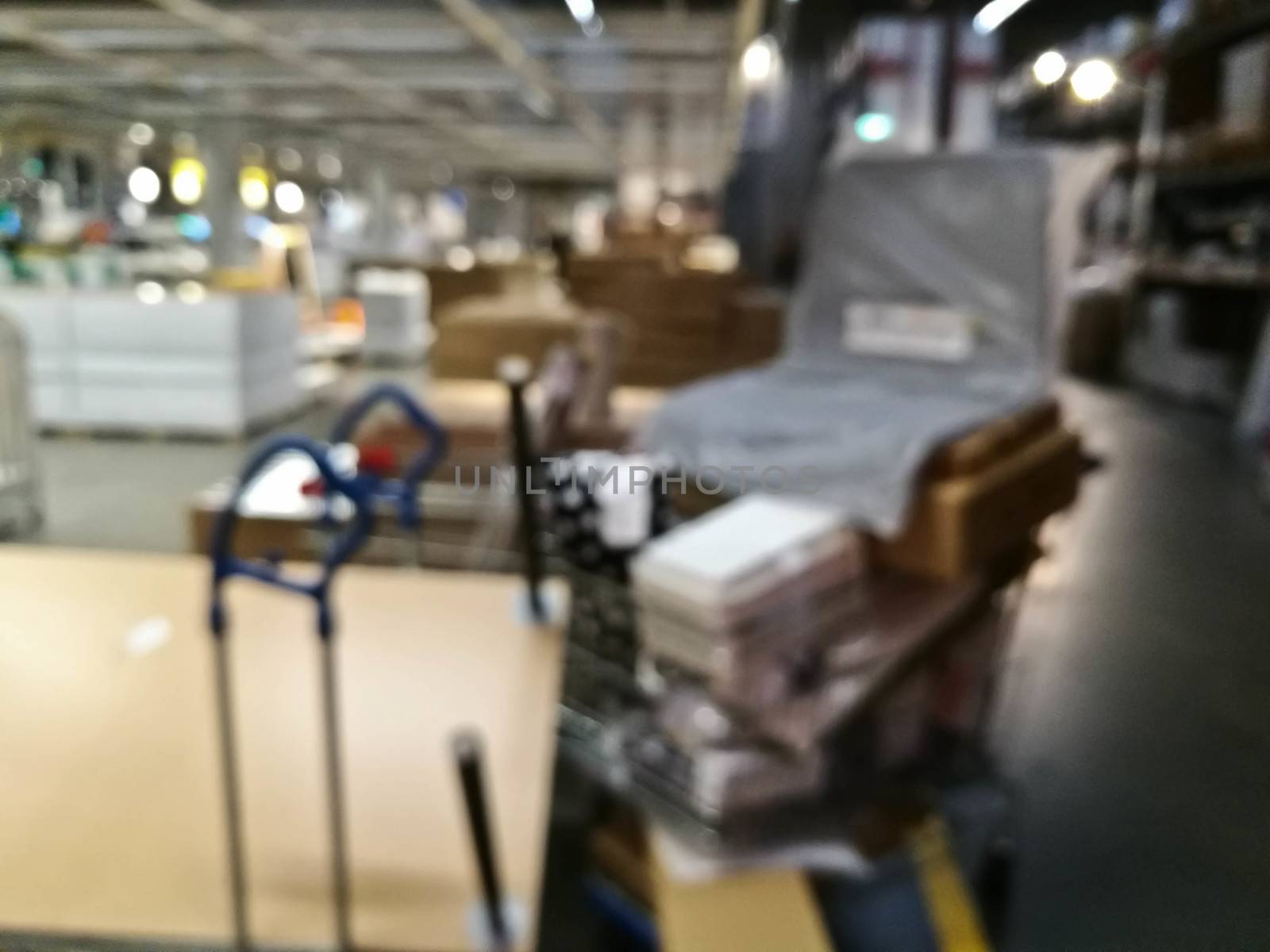 Defocused blurry scene of a self service furniture warehouse sho by eyeofpaul