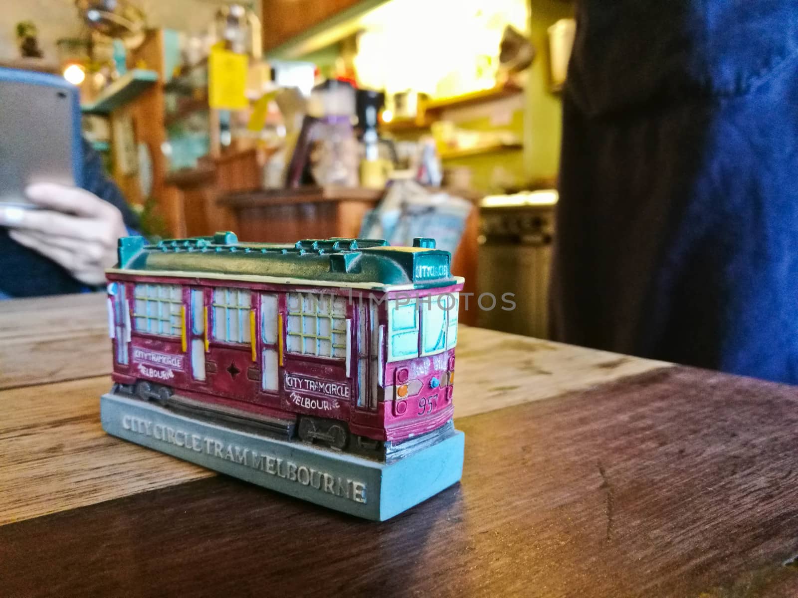 Little tiny Melbourne toy model in a cozy restaurant with many people