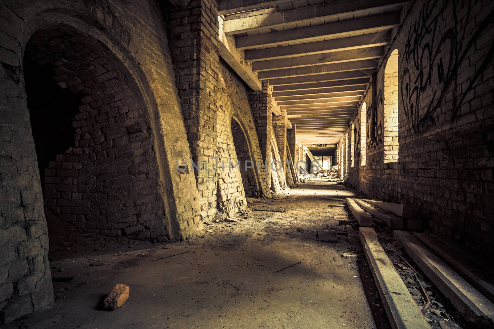 Urban exploring in an old abandoned brick factory, a lost place with ancient history, vandalism and graffiti