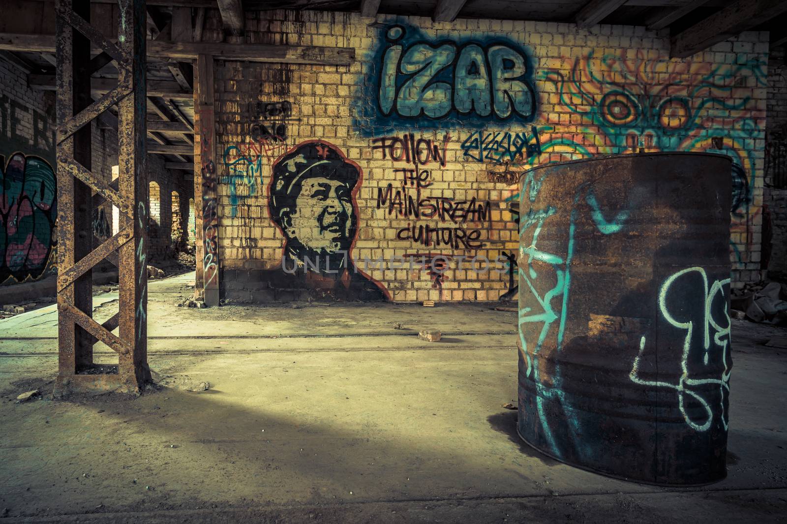 An old abandoned brick factory, a lost place with ancient history, vandalism and graffiti by mindscapephotos