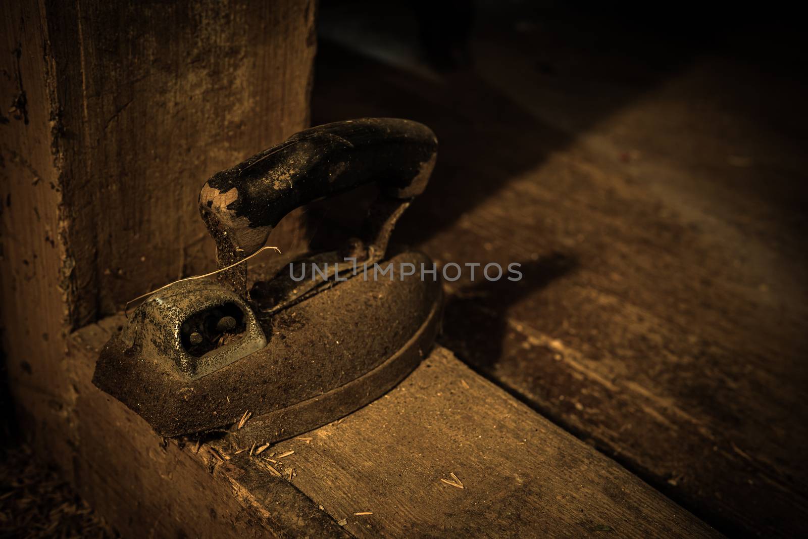 Urban exploring in an old abandoned farm house, a lost place with dirty furniture and dusty paintings