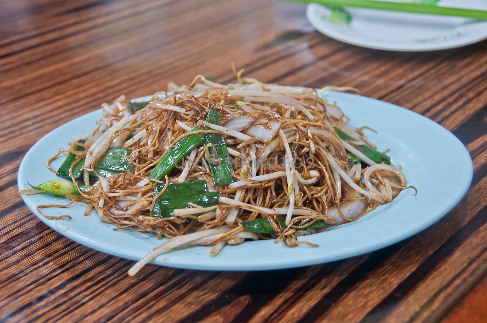 Asian small egg noodle stirred fried with soy sauce and bean sprouts.