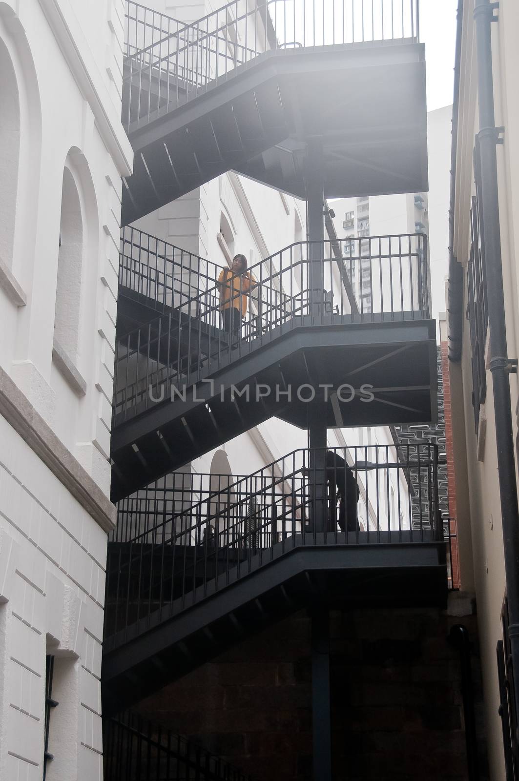 HONG KONG, HONG KONG SAR - NOVEMBER 17, 2018: Scene of Tai Kwun old Hong Kong Prison. There are two people in the photo. by eyeofpaul