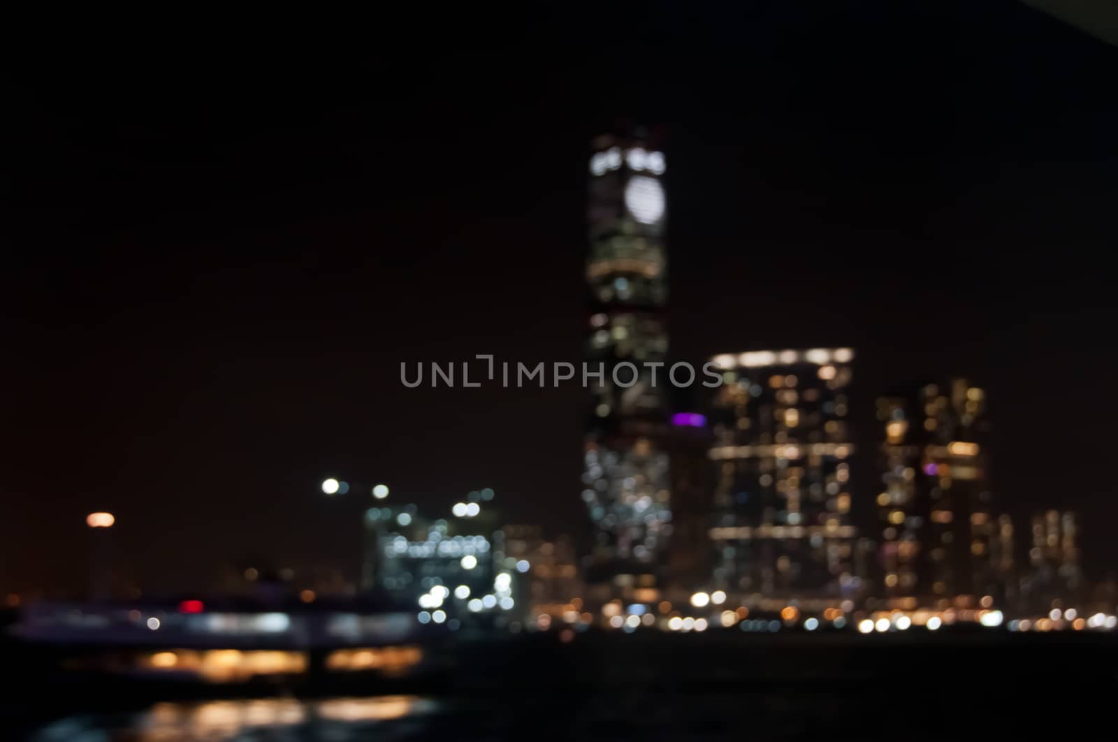 Defocused dark blurry scene of skyscrapers commercial towers in Hong Kong near Victoria Bay