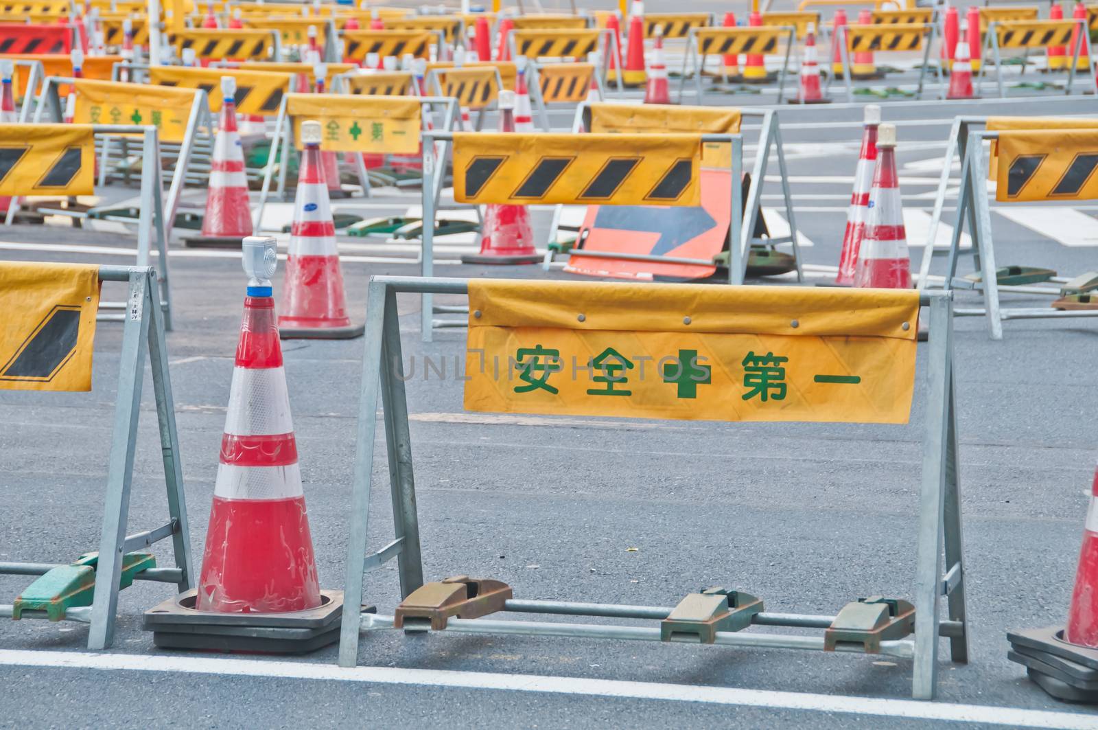 TOKYO, JAPAN - DECEMBER 1, 2018: Temporary barricade with traffic management red cone near construction site in the center of Tokyo in the morning. Nobody is in the photo.