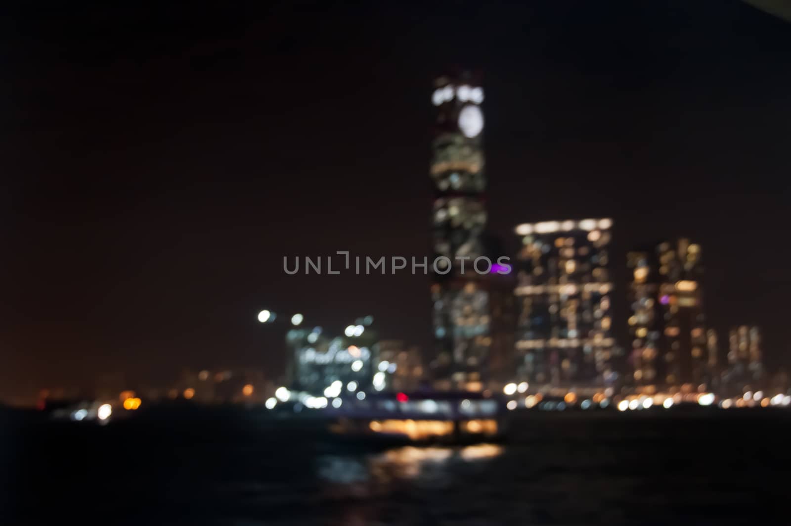 Defocused dark blurry scene of skyscrapers commercial towers in Hong Kong near Victoria Bay