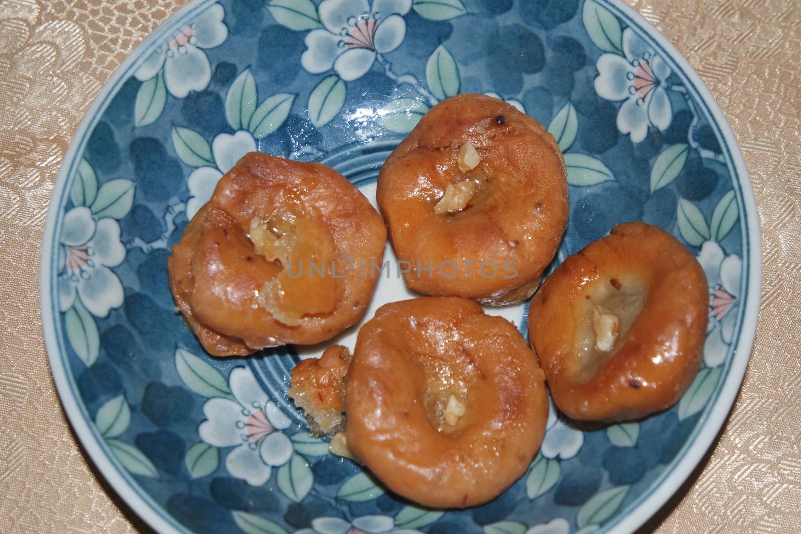 Closeup of delicious and tasty Asian sweet dish called balu shahi or baloshahi or balushahi. This dish is street sweet found in Pakistan India and Bangladesh and served in the festivities.